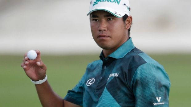 Hideki Matsuyama Holding Golf Ball Background