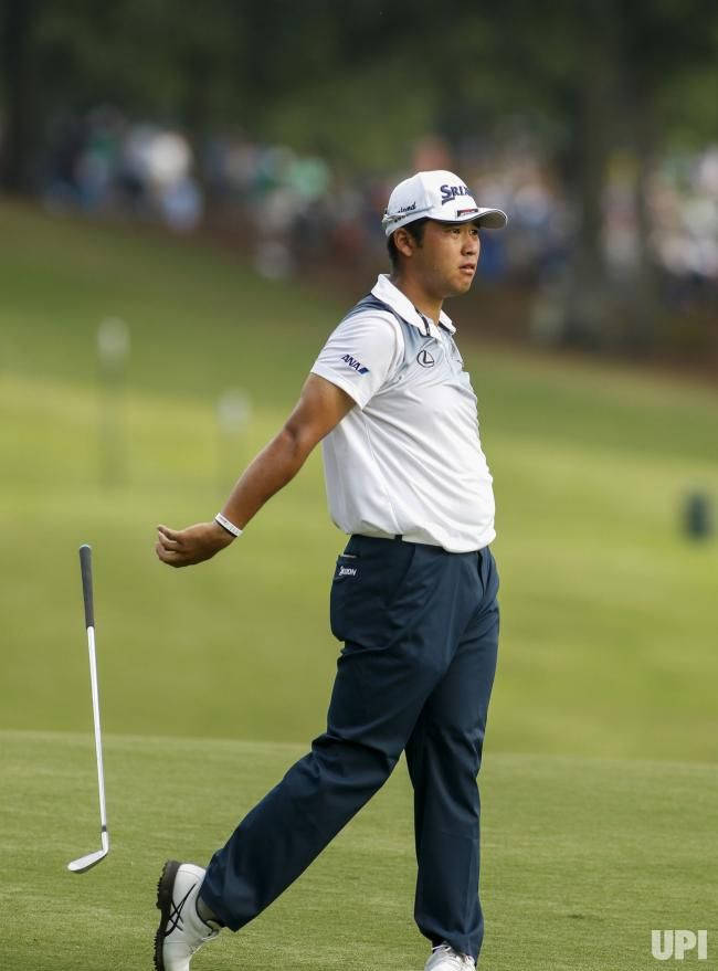 Hideki Matsuyama Letting Go Of Golf Club Background