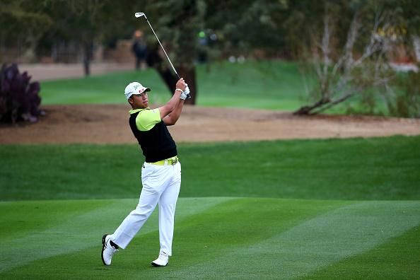 Hideki Matsuyama Playing In Golf Course Background