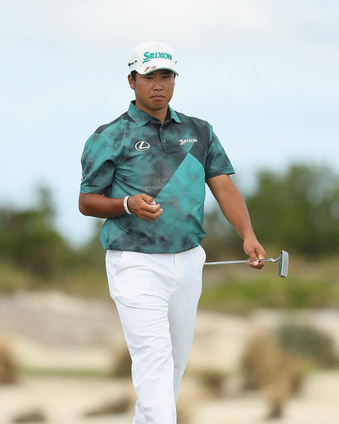 Hideki Matsuyama Wearing Printed Green Shirt Background