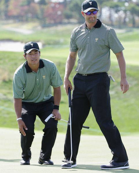 Hideki Matsuyama With Fellow Golfer Background