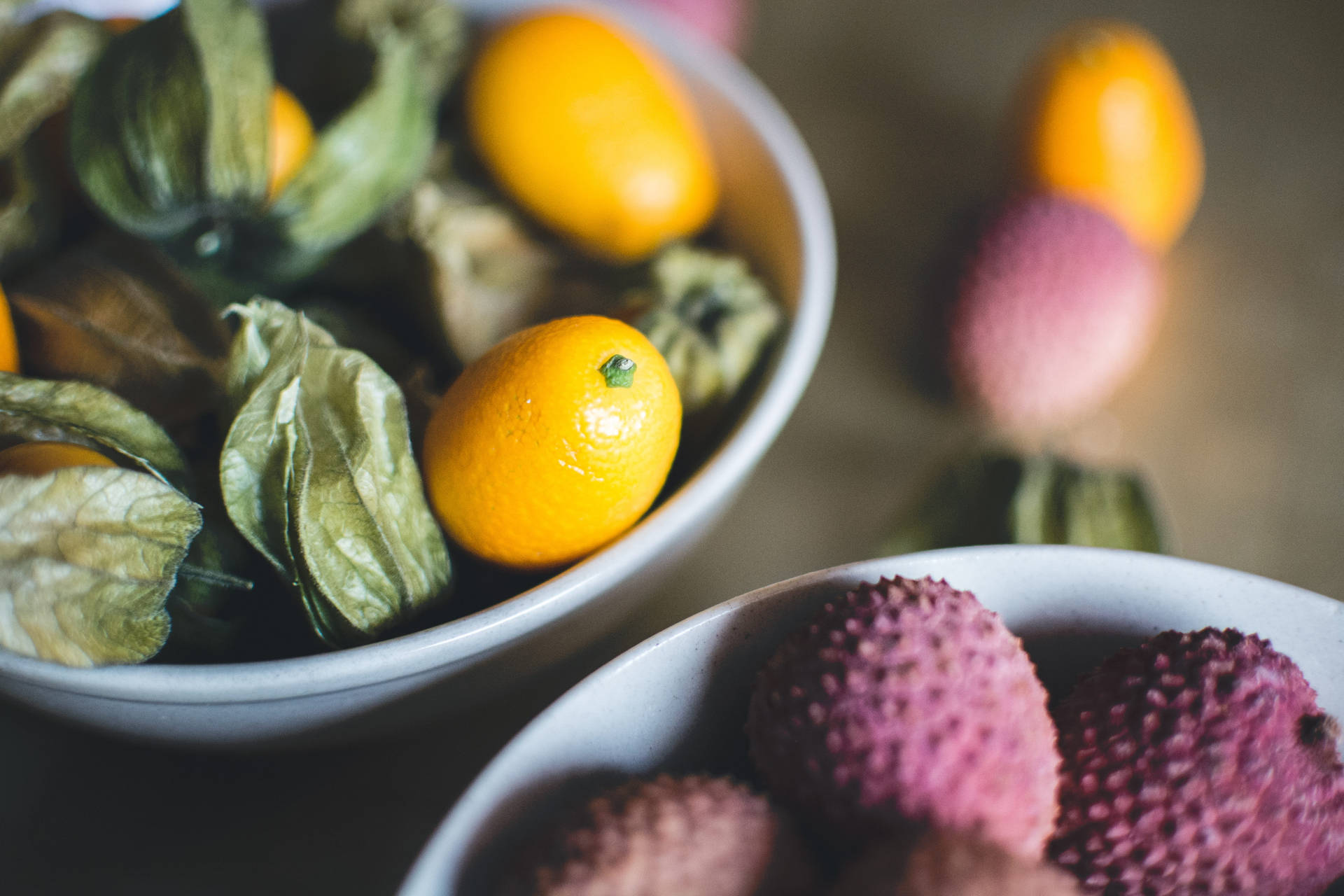 High Angle View Of Fresh Kumquat And Lychee Fruits