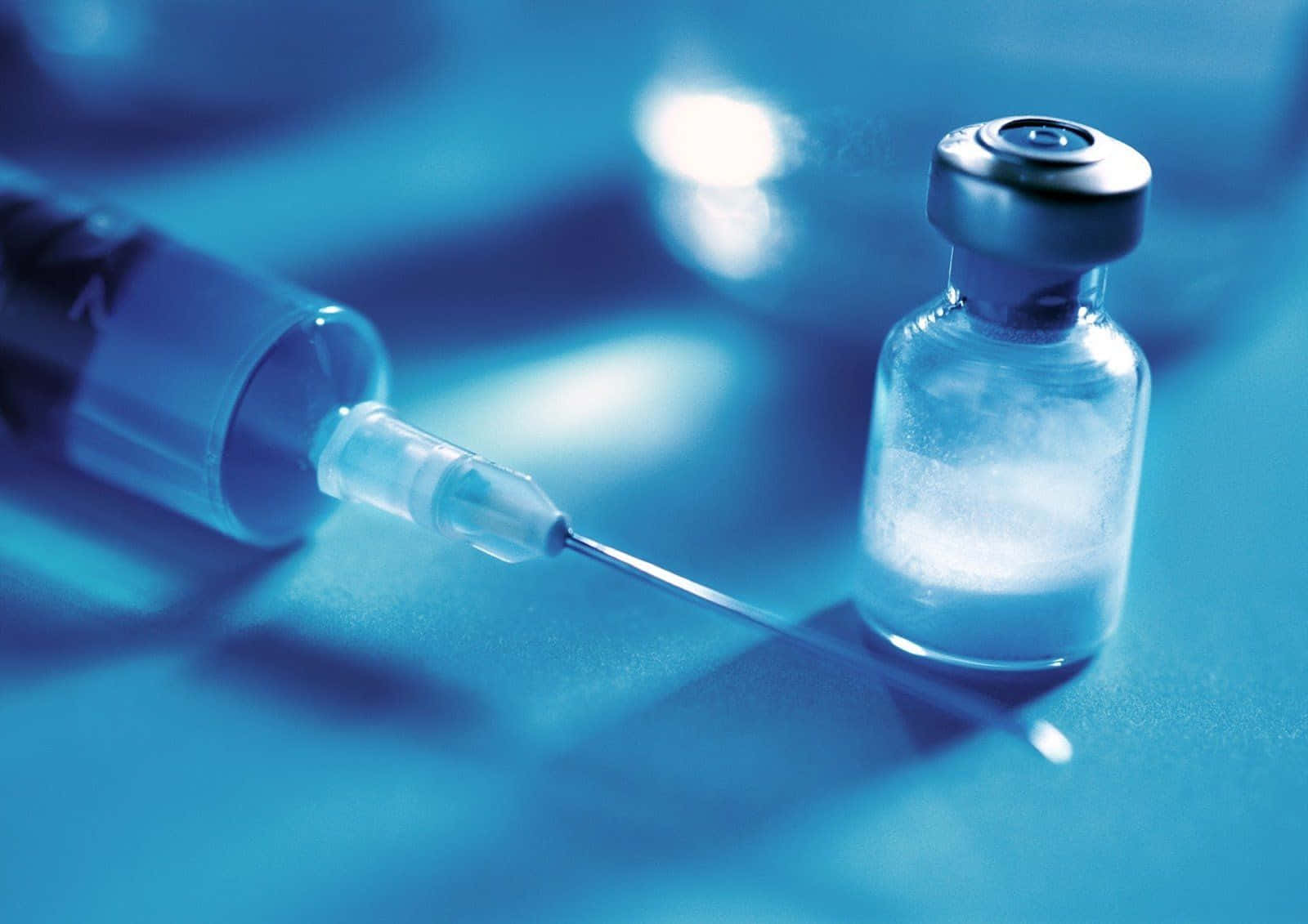High-definition Image Of Medical Syringe And Tiny Bottle Background