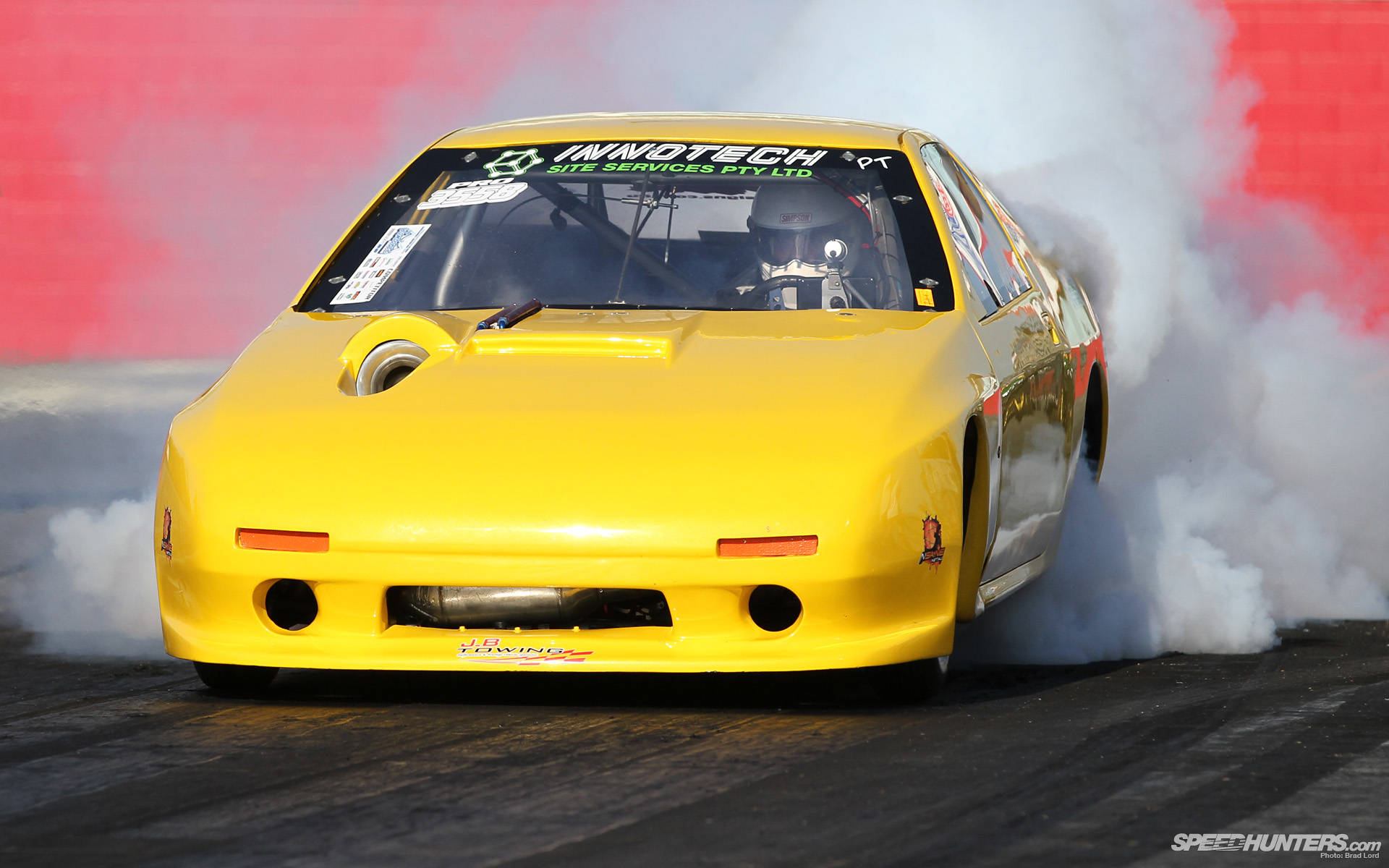 High-intensity Drag Racing With Yellow Mazda Rx-7