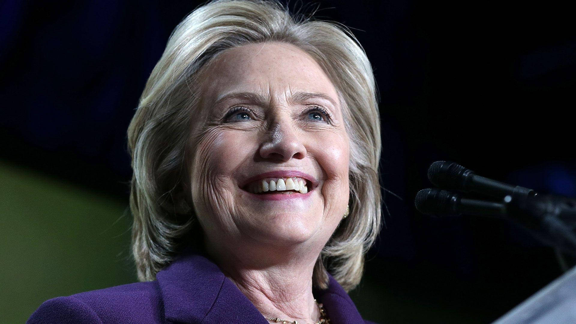Hillary Clinton In A Cheerful Mood Background