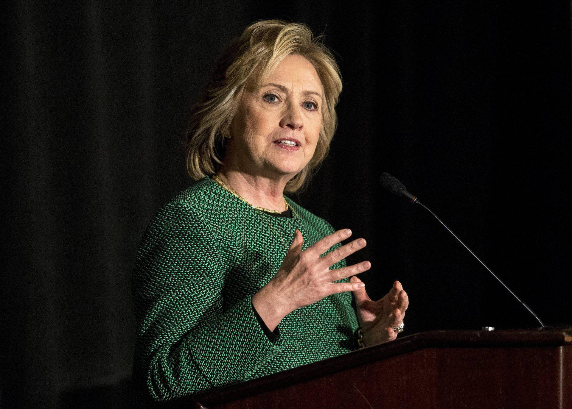 Hillary Clinton In Confident Conversation. Background