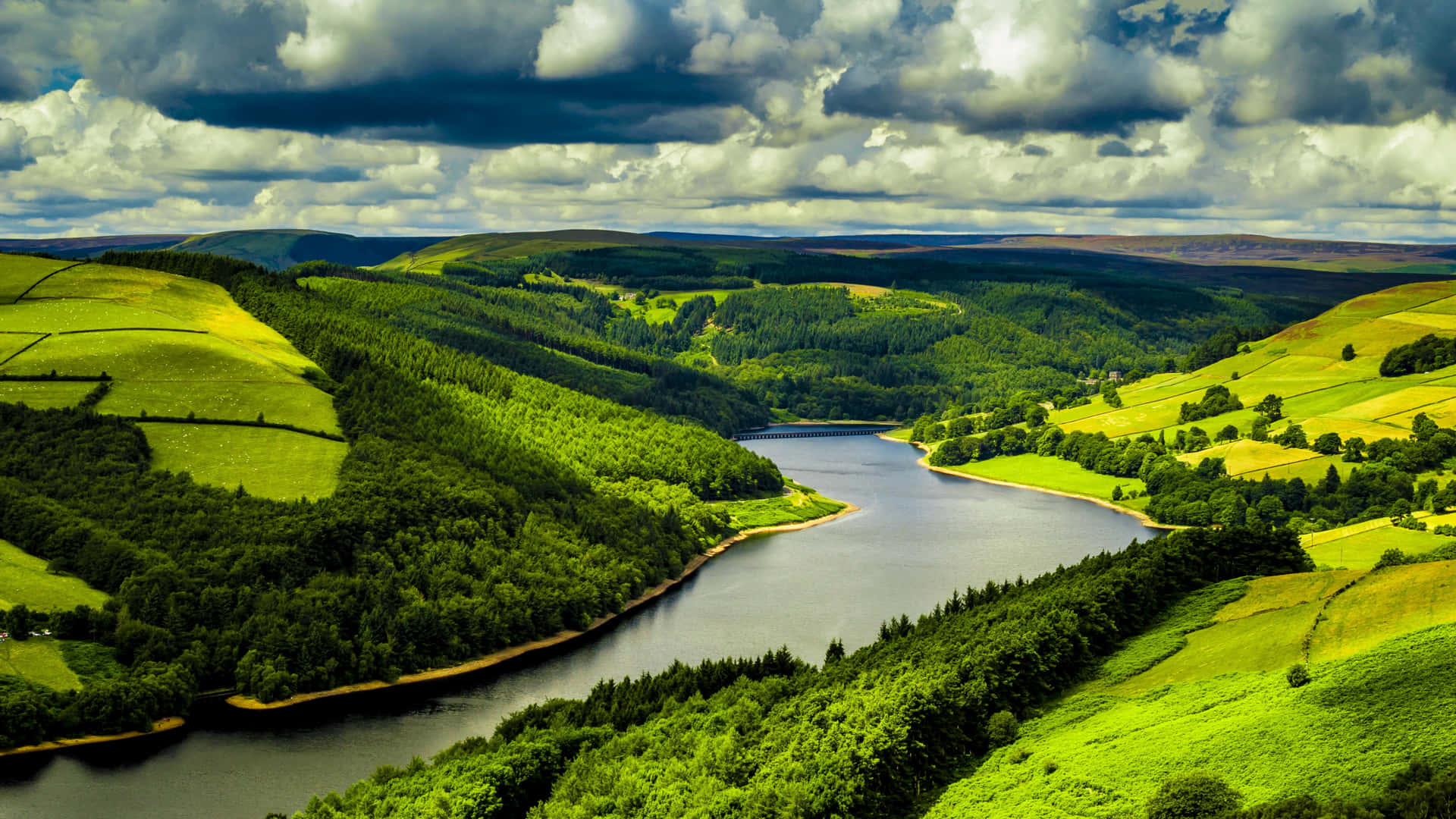 Hills Surrounding A River Background