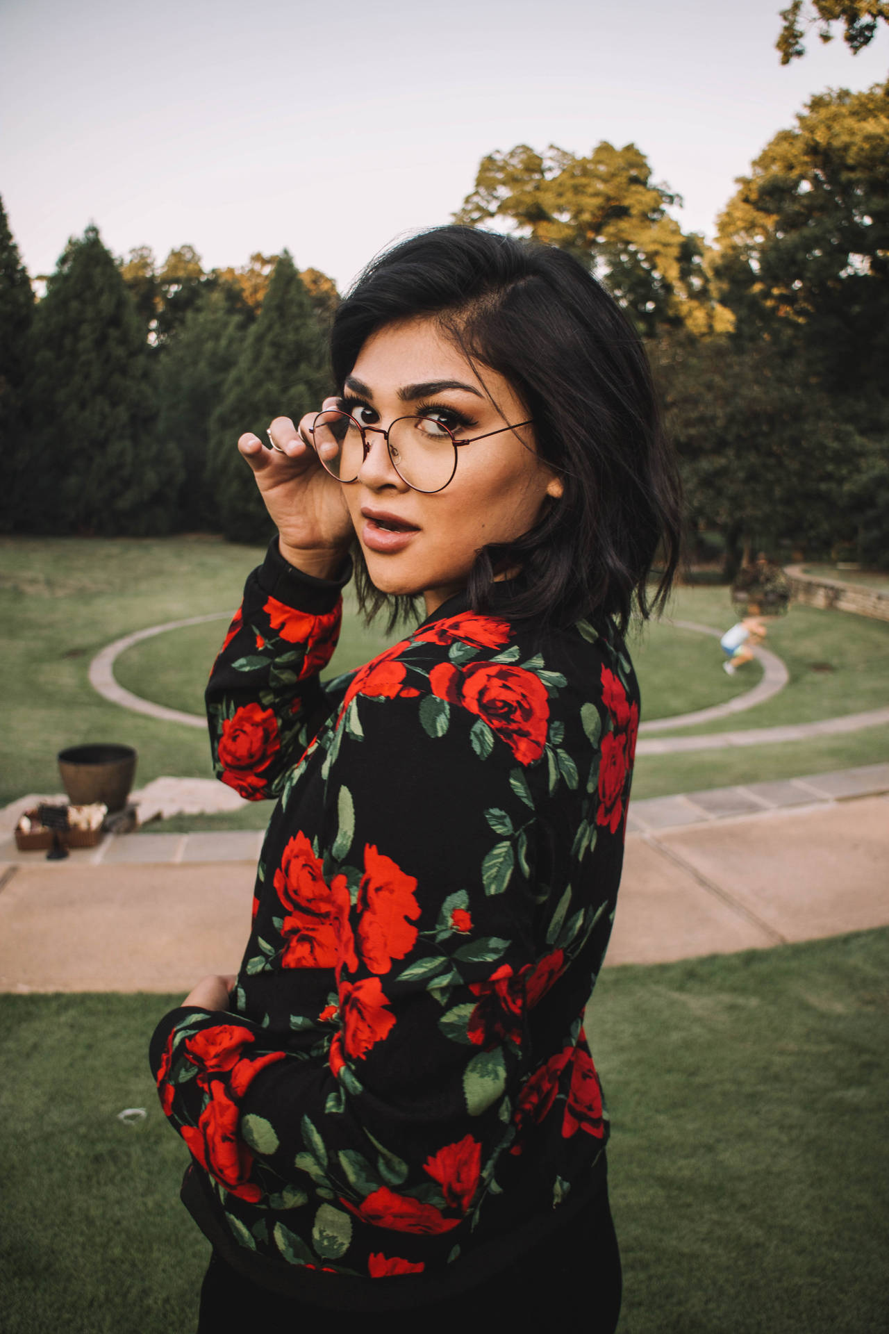 Hipster Girl In Red Roses Dress Background