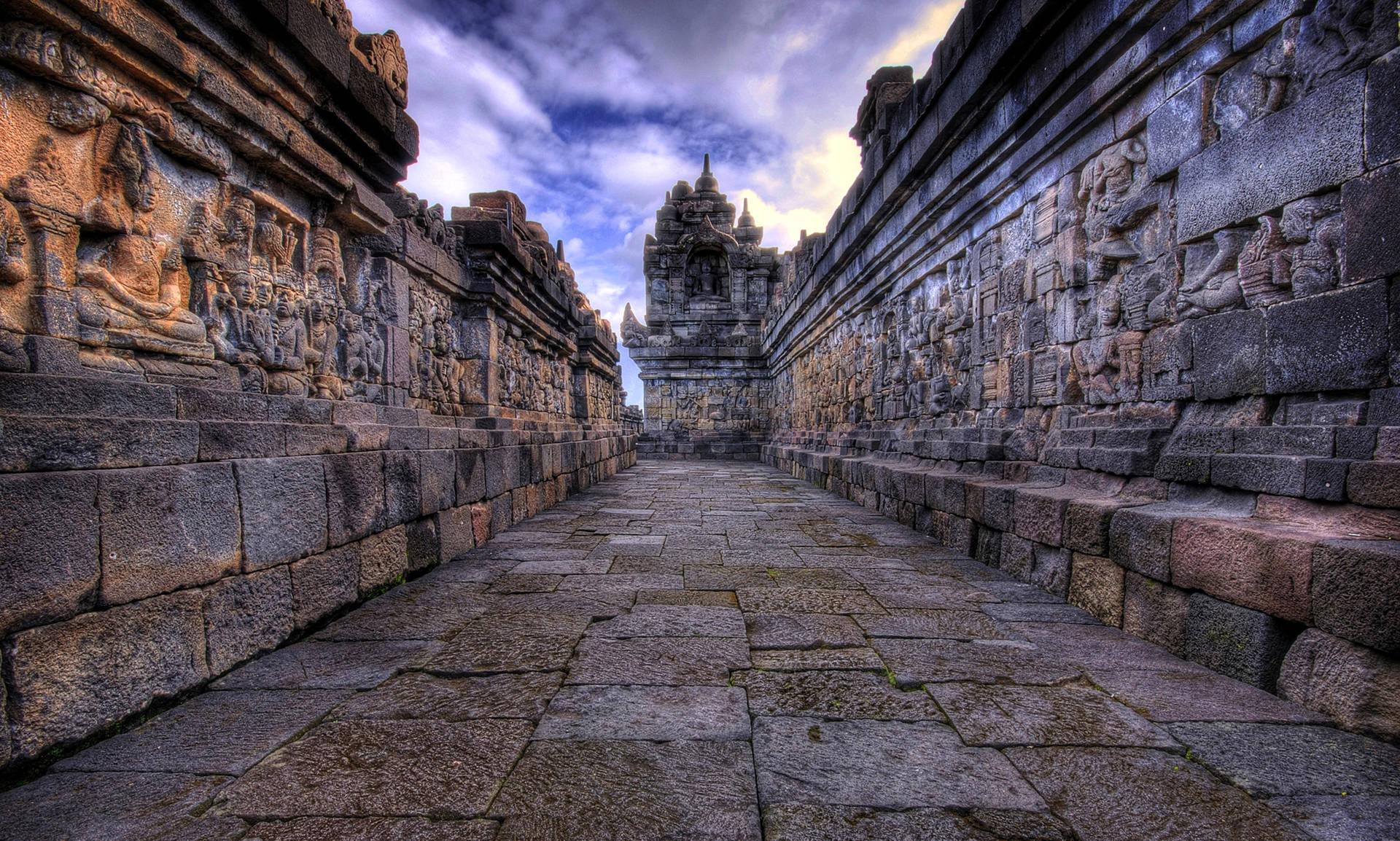 Historical Ruins Of A Walkway In Angkor Wat Background