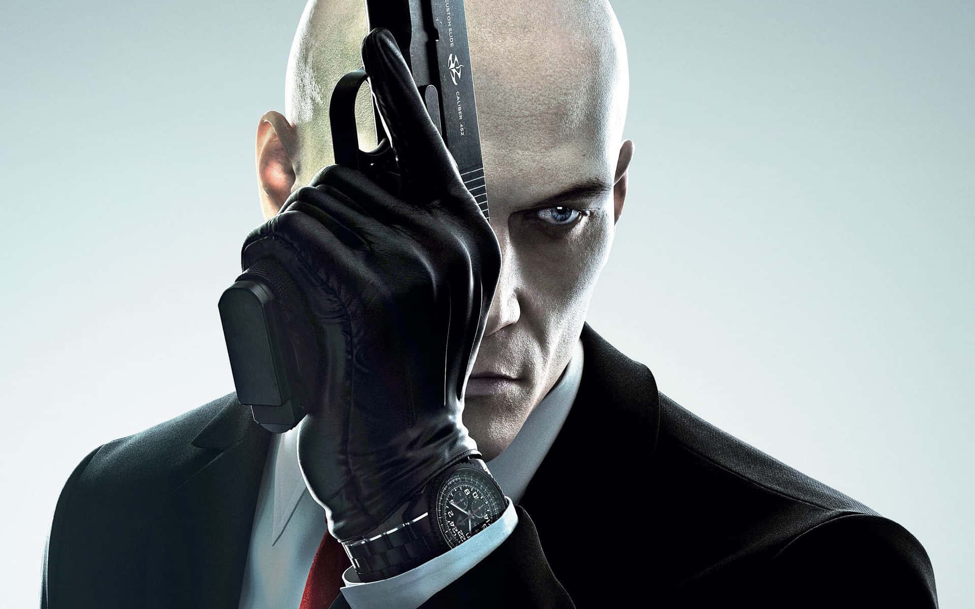 Hitman Agent 47 Covering Face With Gun Background