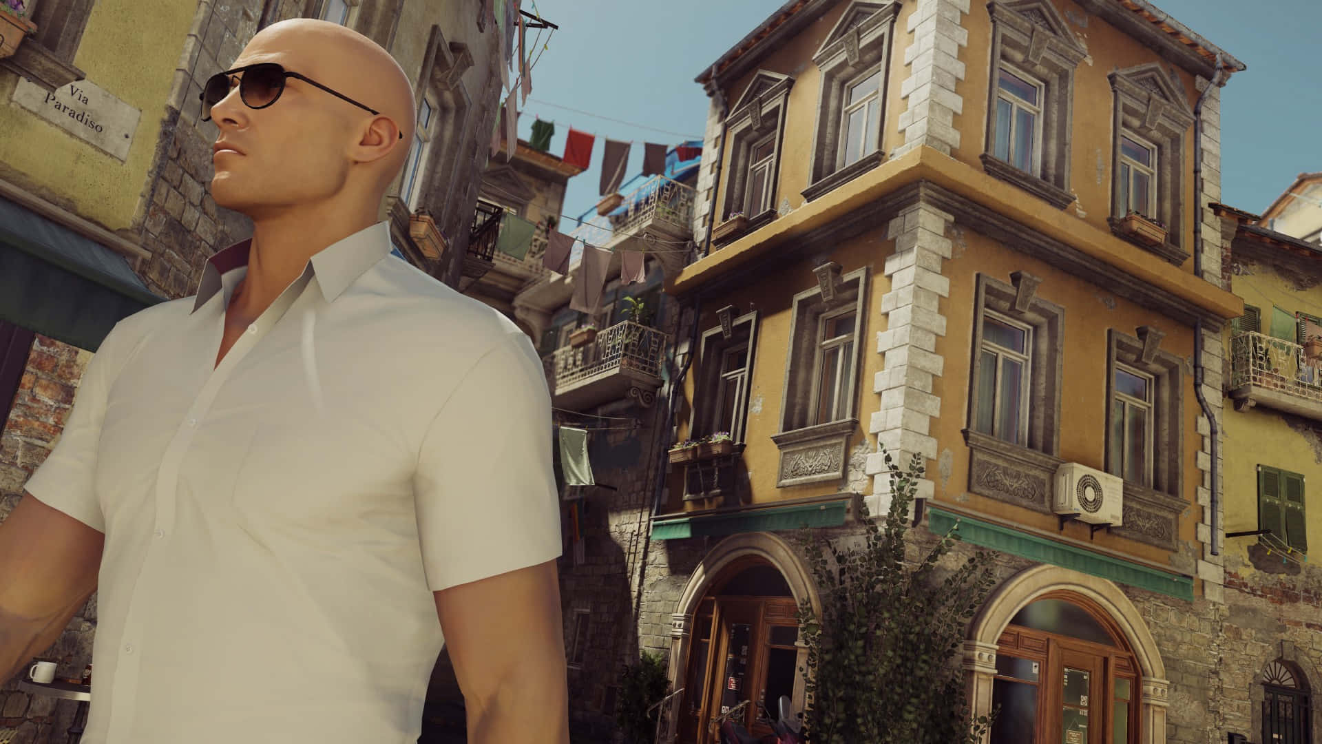 Hitman Agent 47 Passing By Traditional Houses Background