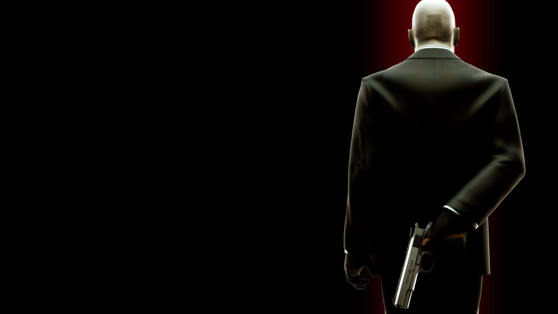 Hitman With Gun Behind Desktop Background