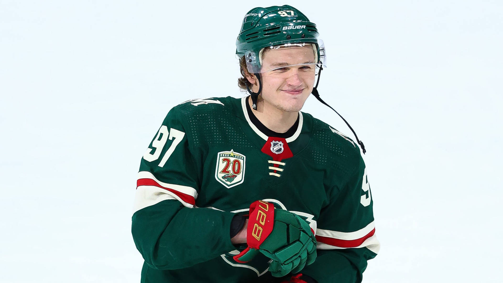 Hockey Player Kirill Kaprizov Smiling Background