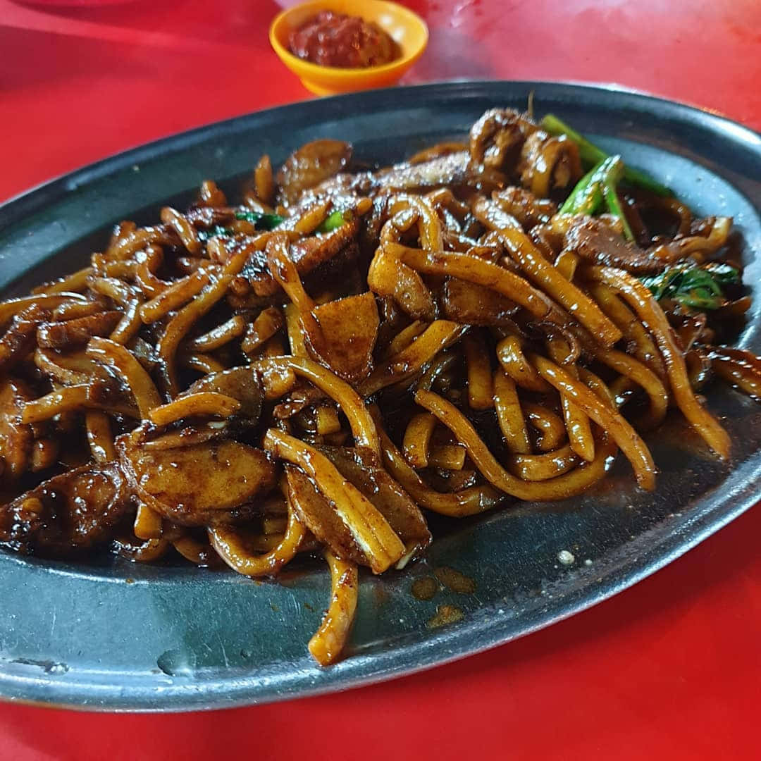 Hokkien Mee Coated In Dark Sauce Background