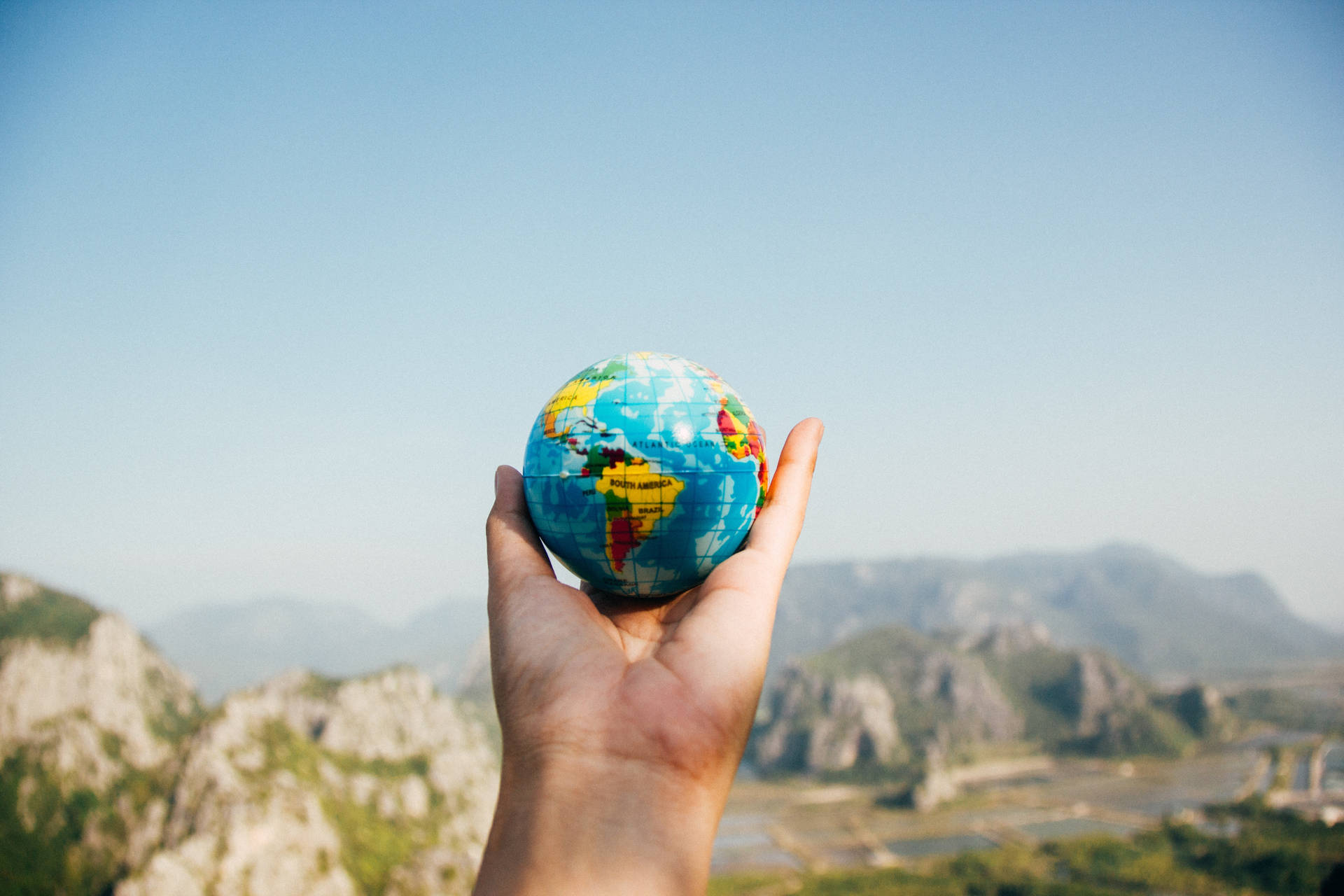 Holding An International Globe Background