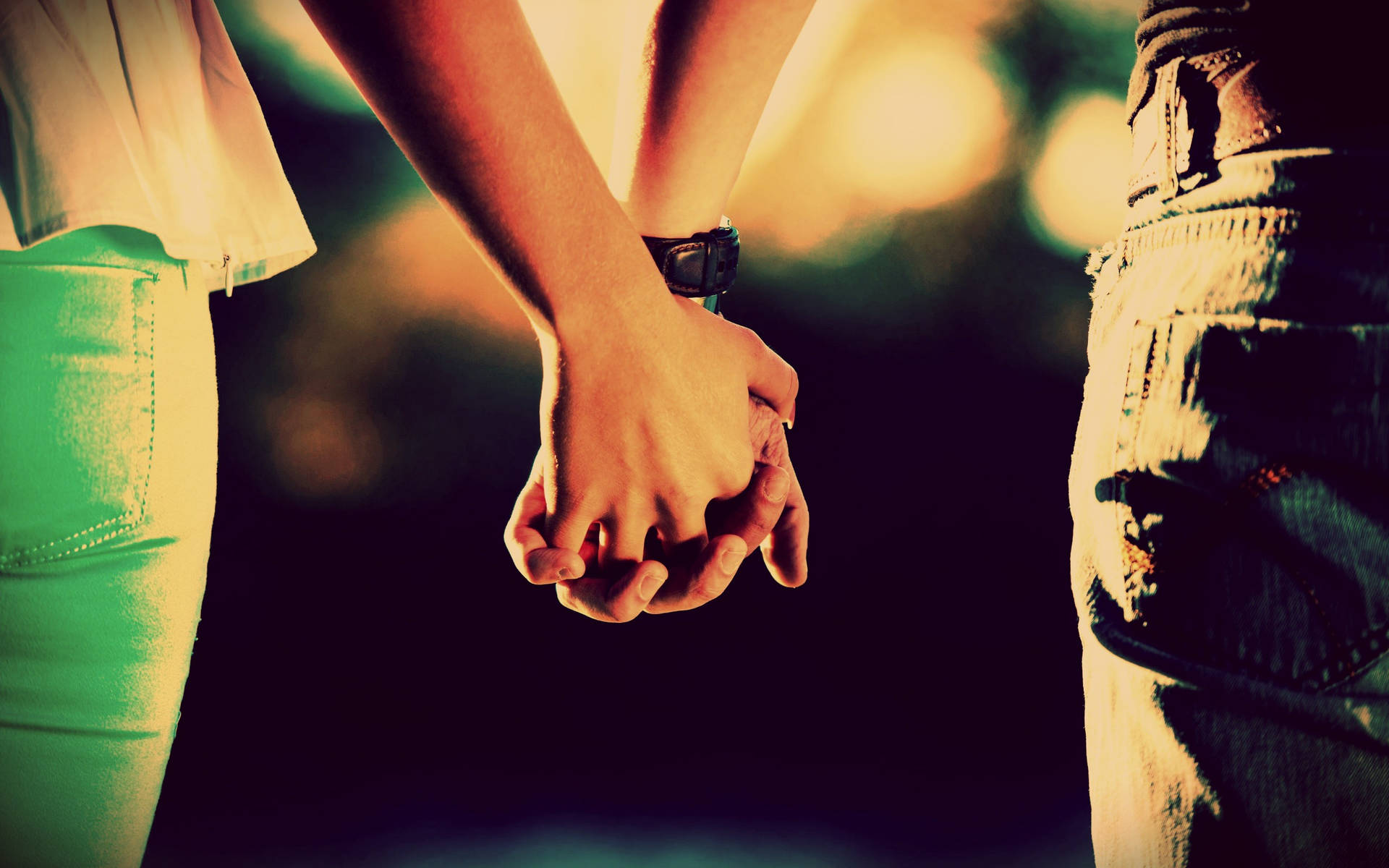 Holding Hands Back Angle Shot In Bokeh Effect Background