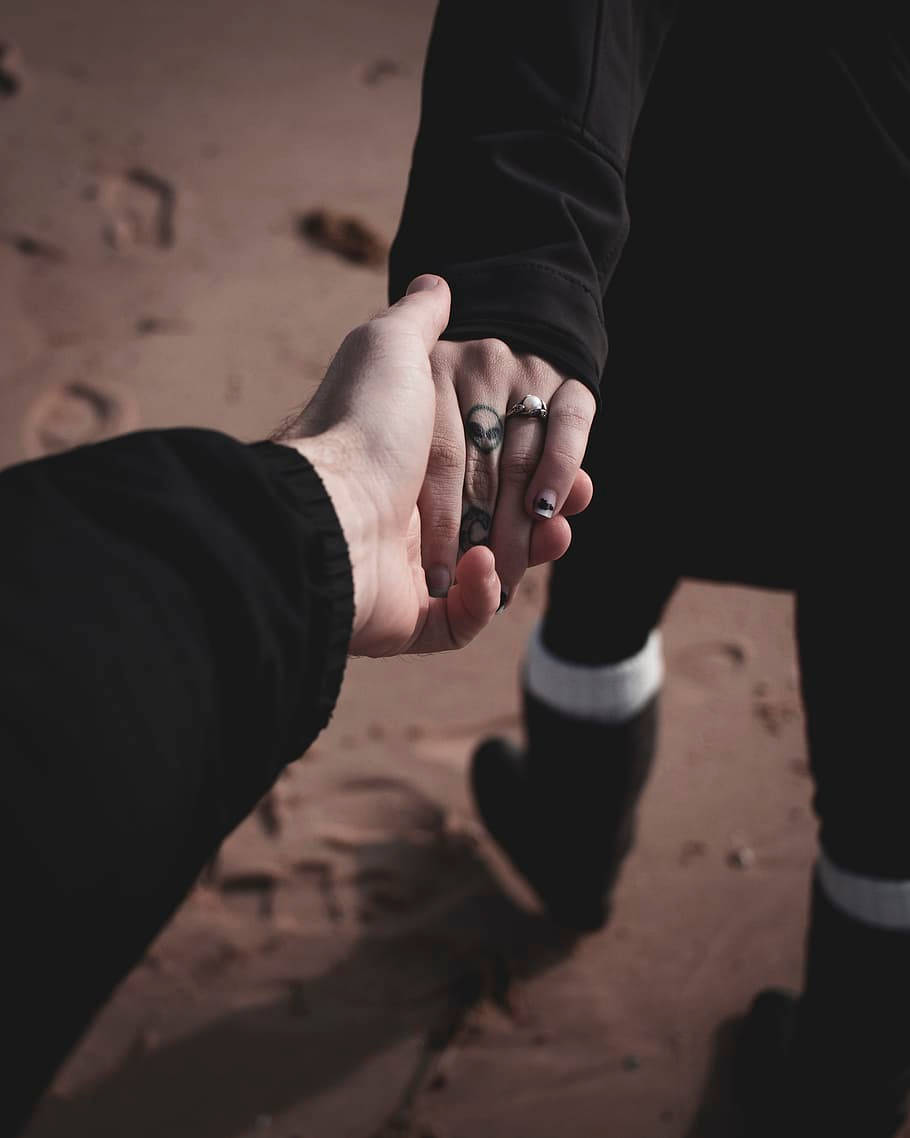 Holding Hands In The Sand