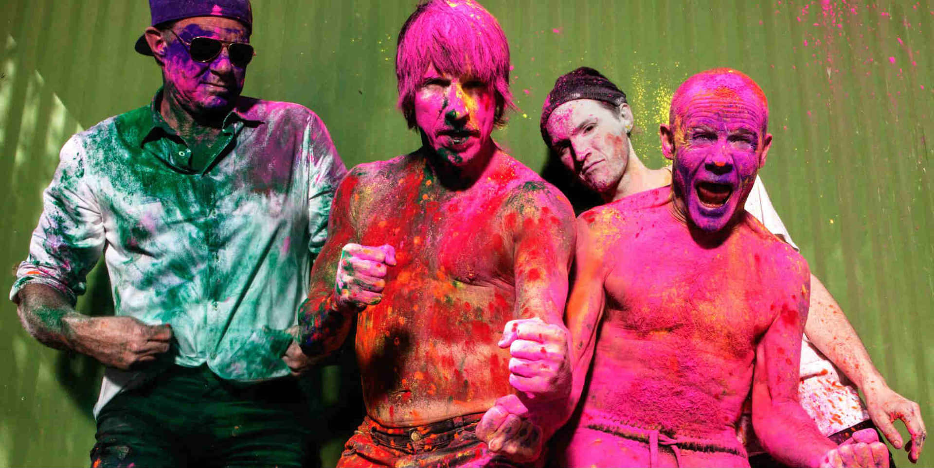 Holi Festival - A Group Of Men With Paint On Their Faces