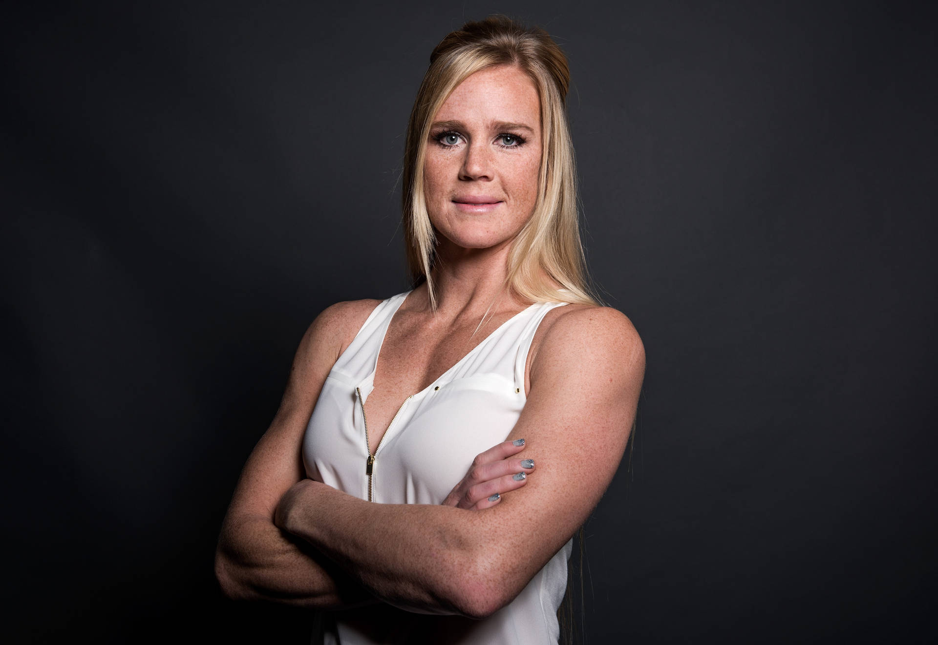 Holly Holm Wearing White Blouse Background