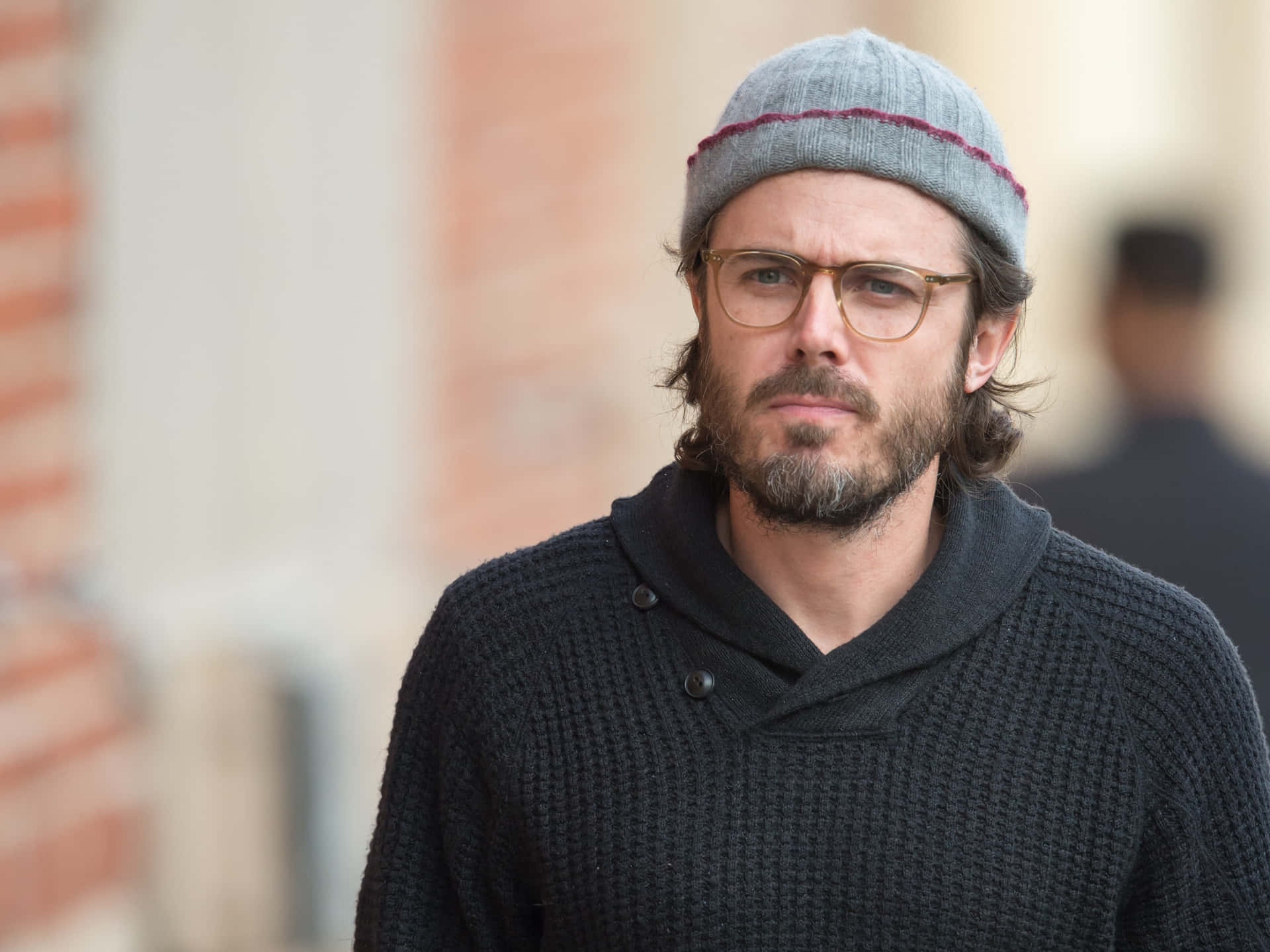 Hollywood Actor Casey Affleck In A Black Suit Background