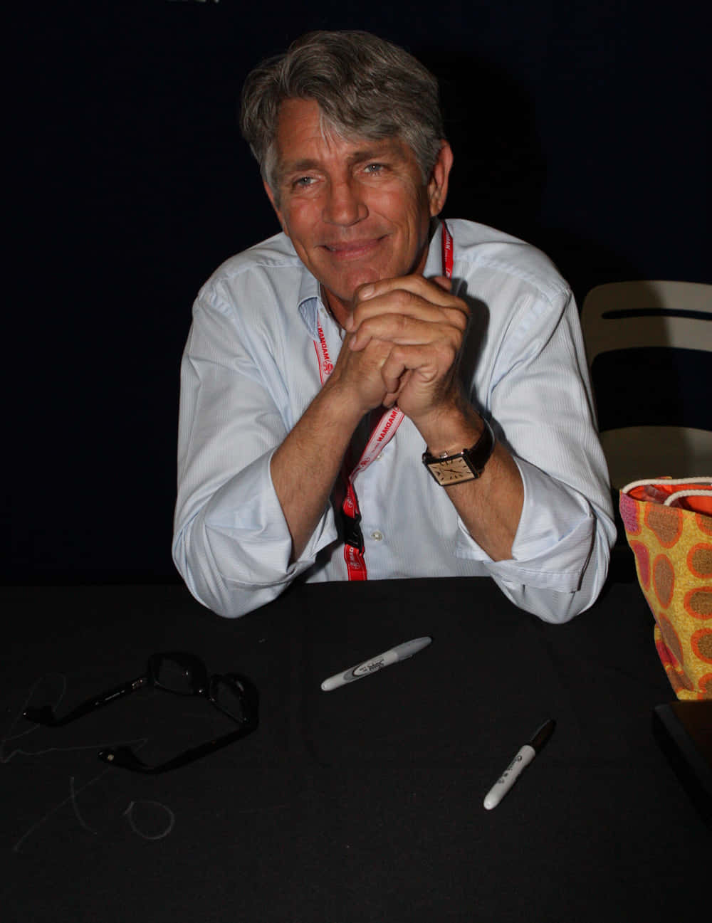 Hollywood Actor Eric Roberts In A Casual Stare Background
