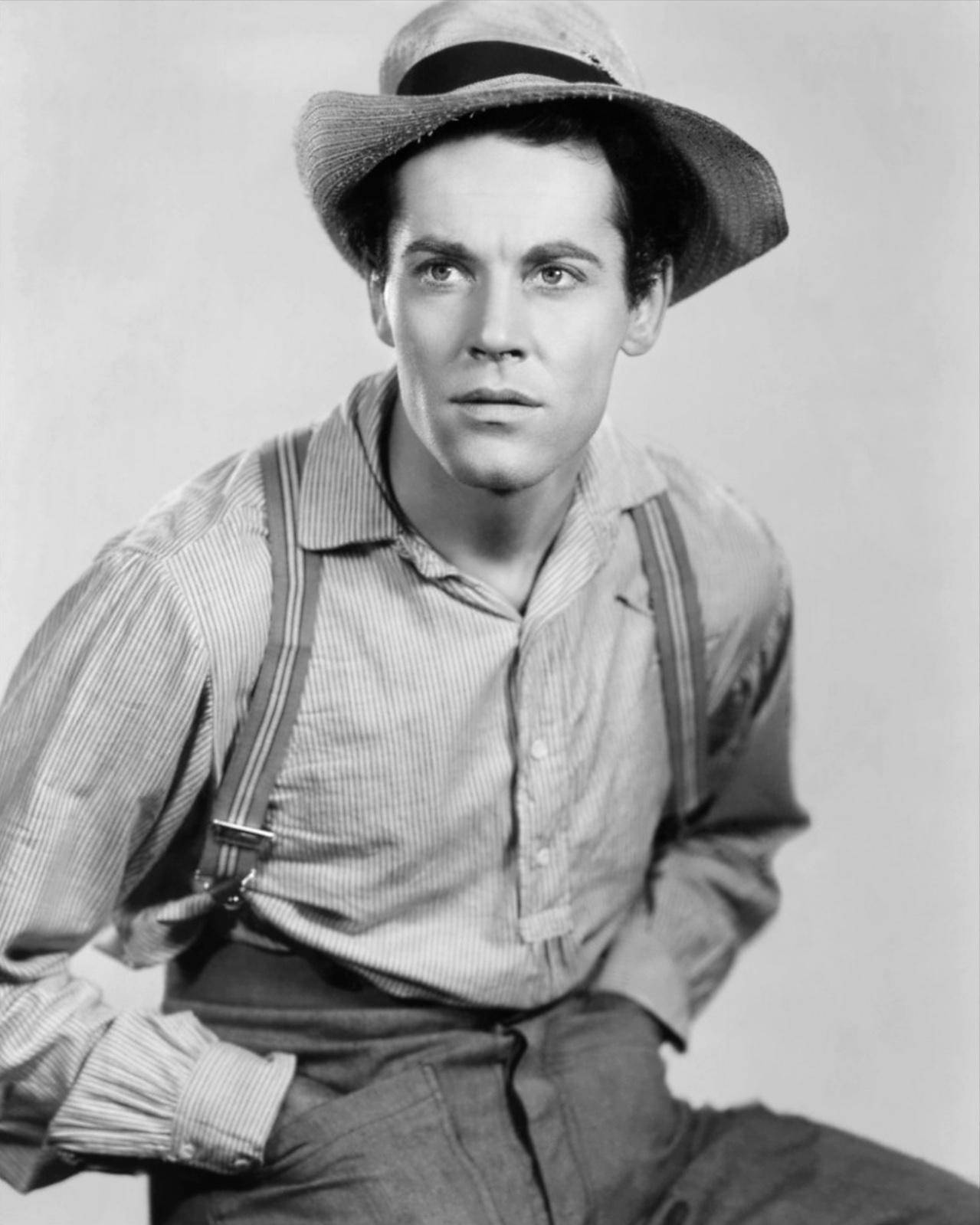 Hollywood Actor Henry Fonda In Classic Farming Attire Background