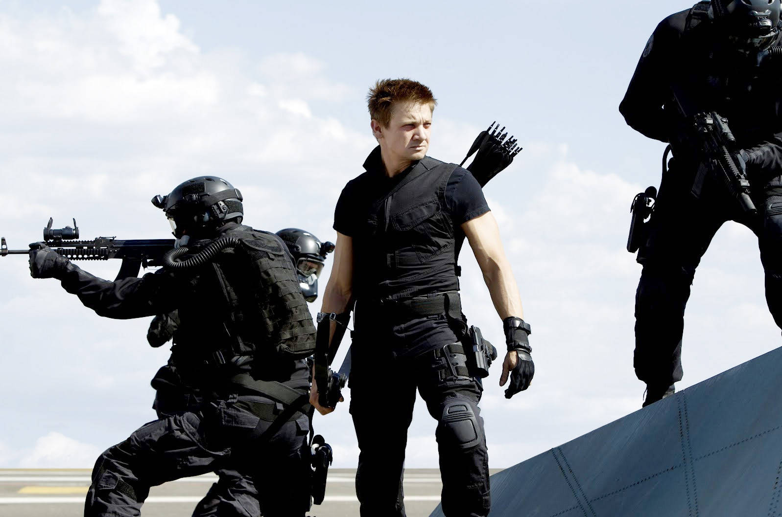 Hollywood Actor Jeremy Renner Posing With His Squad Background