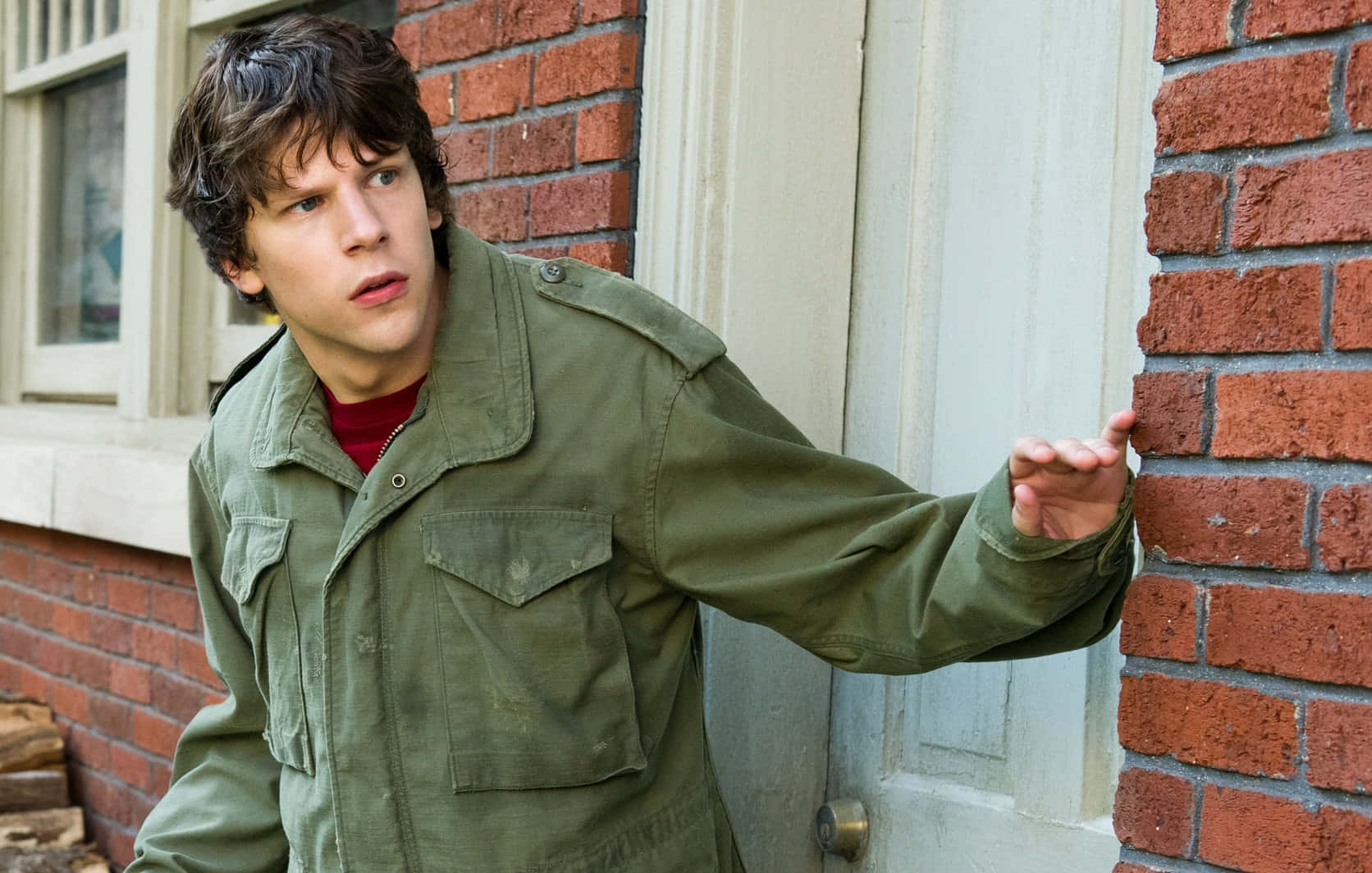 Hollywood Actor Jesse Eisenberg Looking Dashing In A Casual Outfit Background