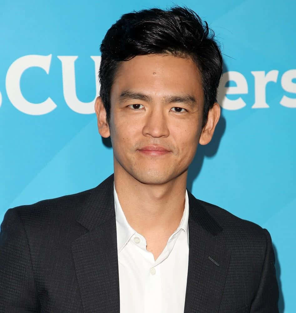 Hollywood Actor John Cho Posing For A Portrait Background