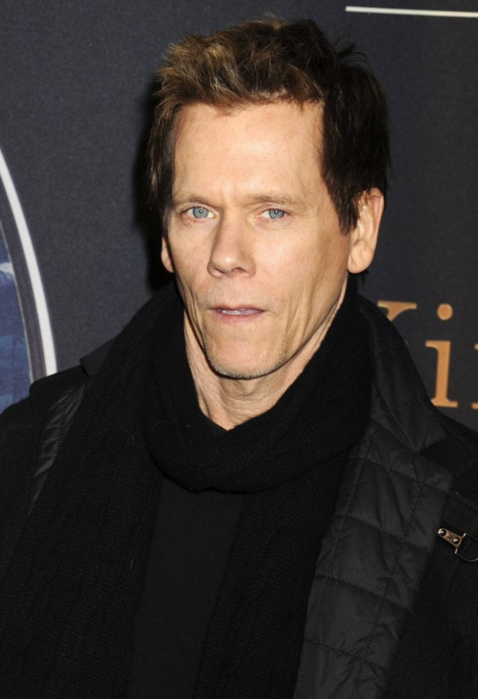 Hollywood Actor Kevin Bacon Posing In A Stylish Black Jacket Background