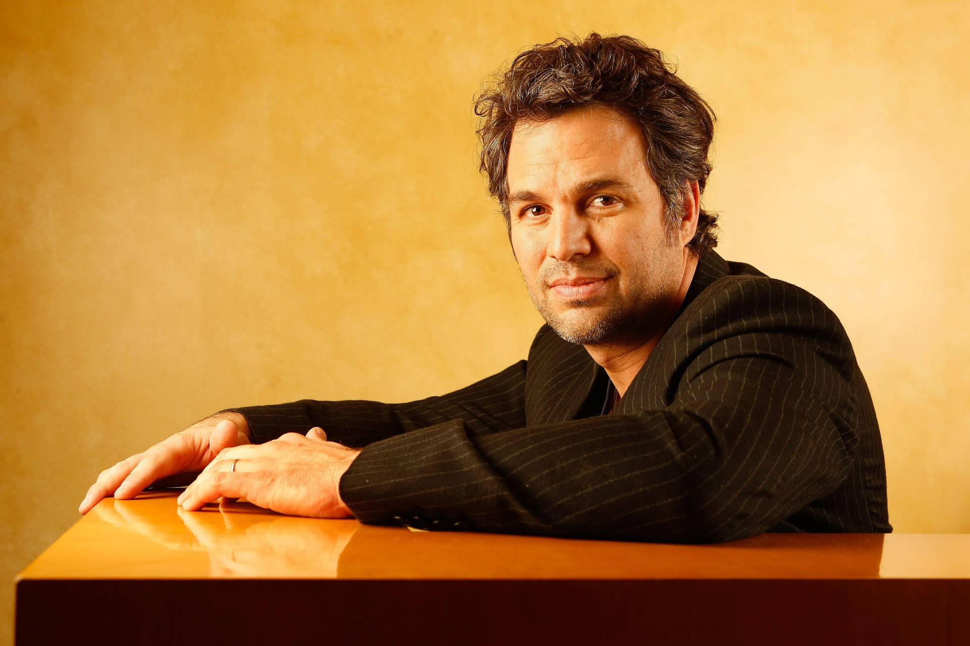 Hollywood Actor Mark Ruffalo In A Pensive Moment Background