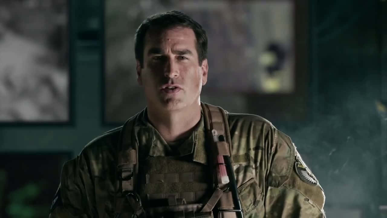Hollywood Actor Rob Riggle Captured In A Candid Moment Background