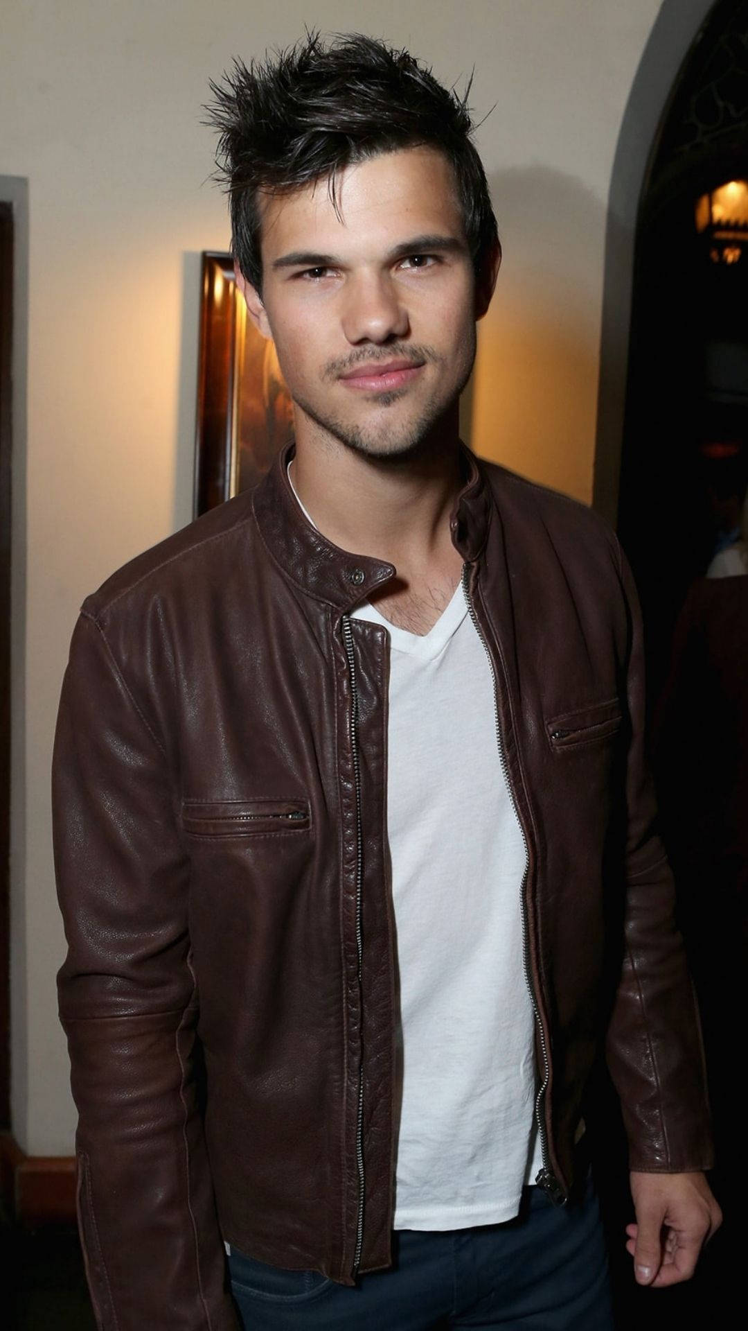 Hollywood Actor Taylor Lautner Donning A Leather Jacket