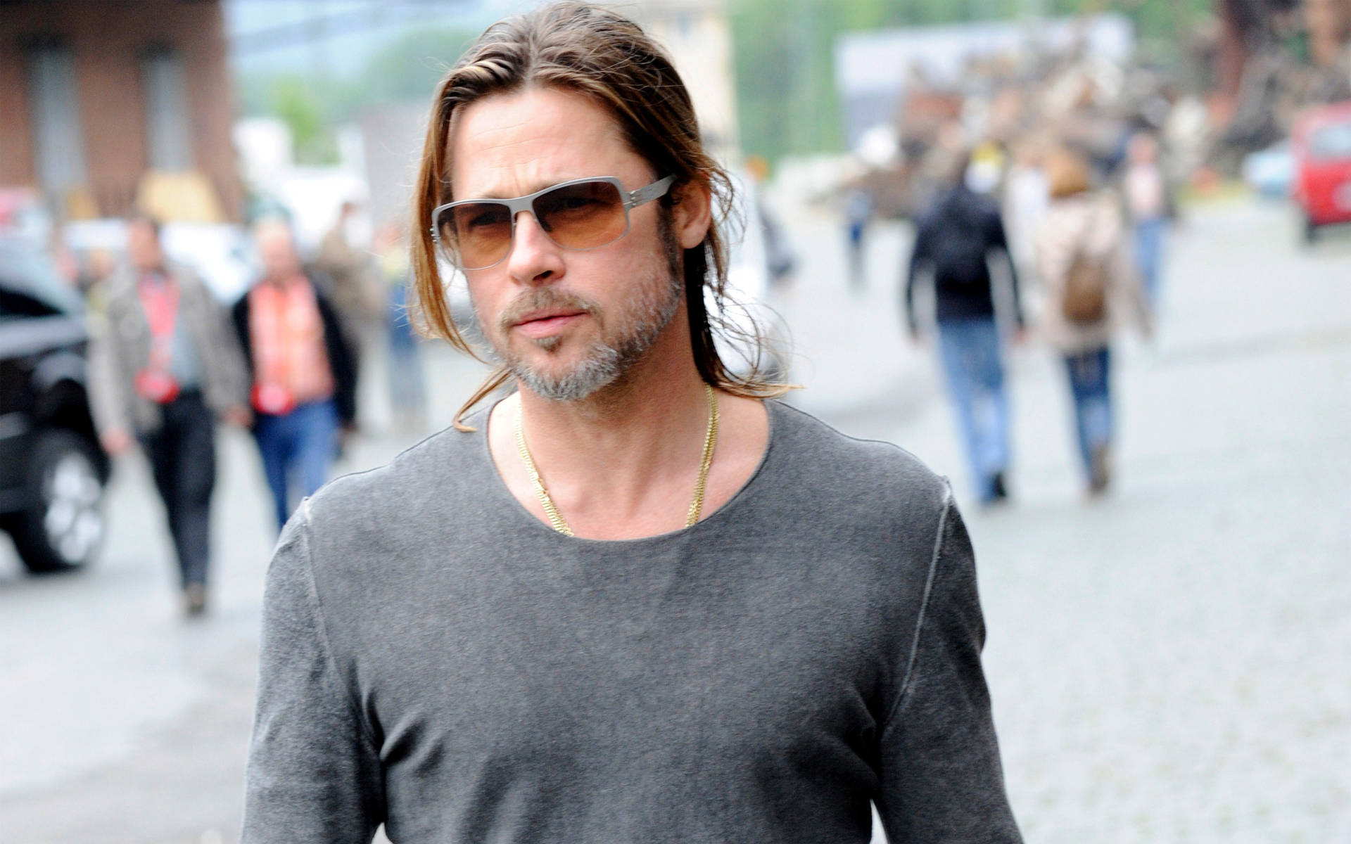 Hollywood Icon Brad Pitt Taking A Stroll Background