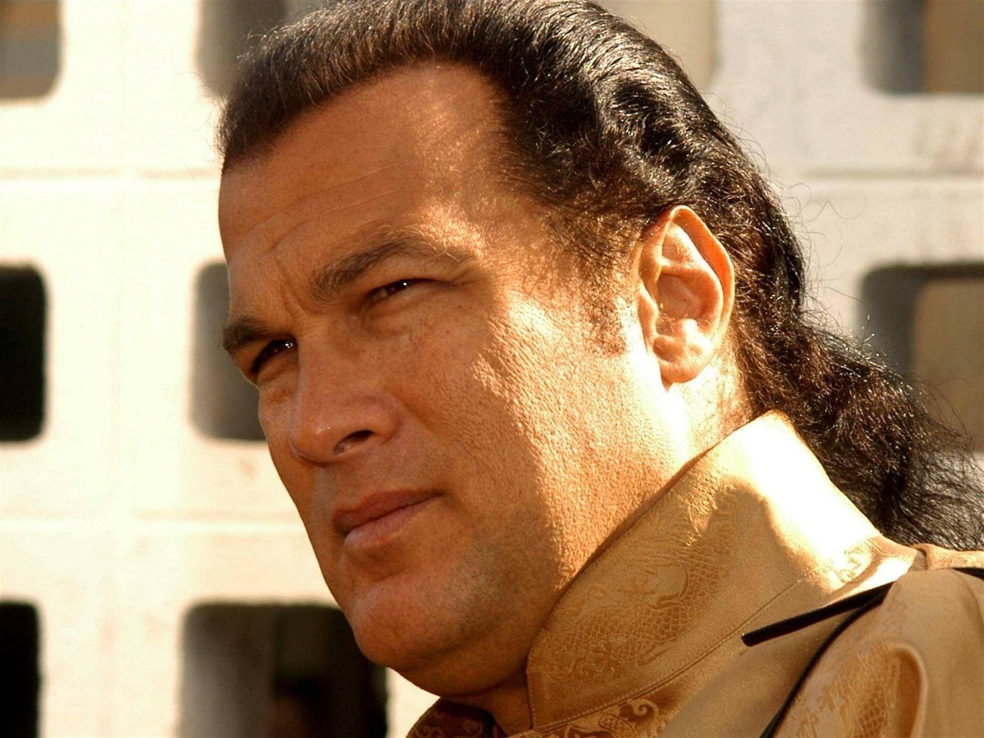 Hollywood Icon, Steven Seagal In Promotional Still Background