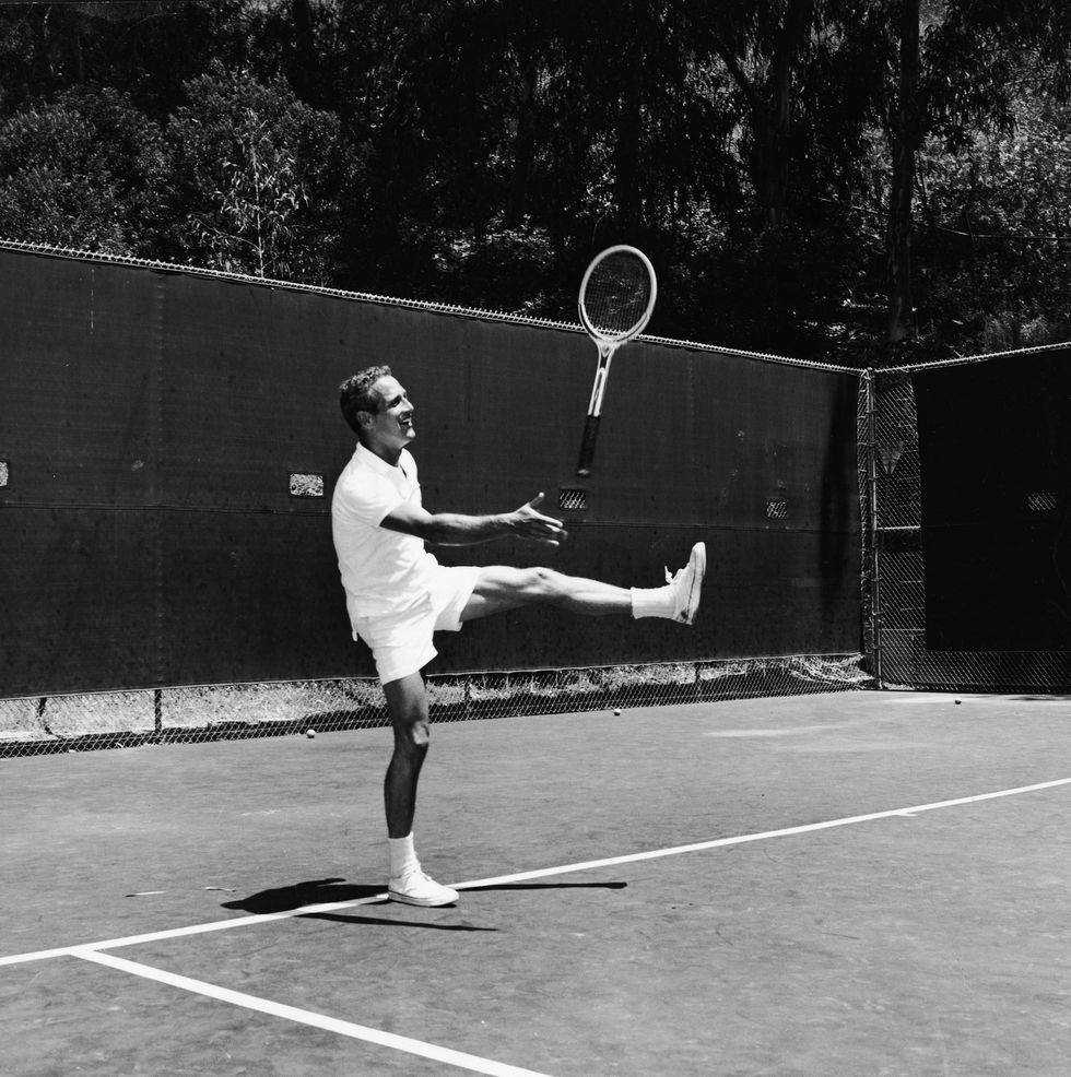 Hollywood Legend Paul Newman Enjoying A Game Of Tennis Background