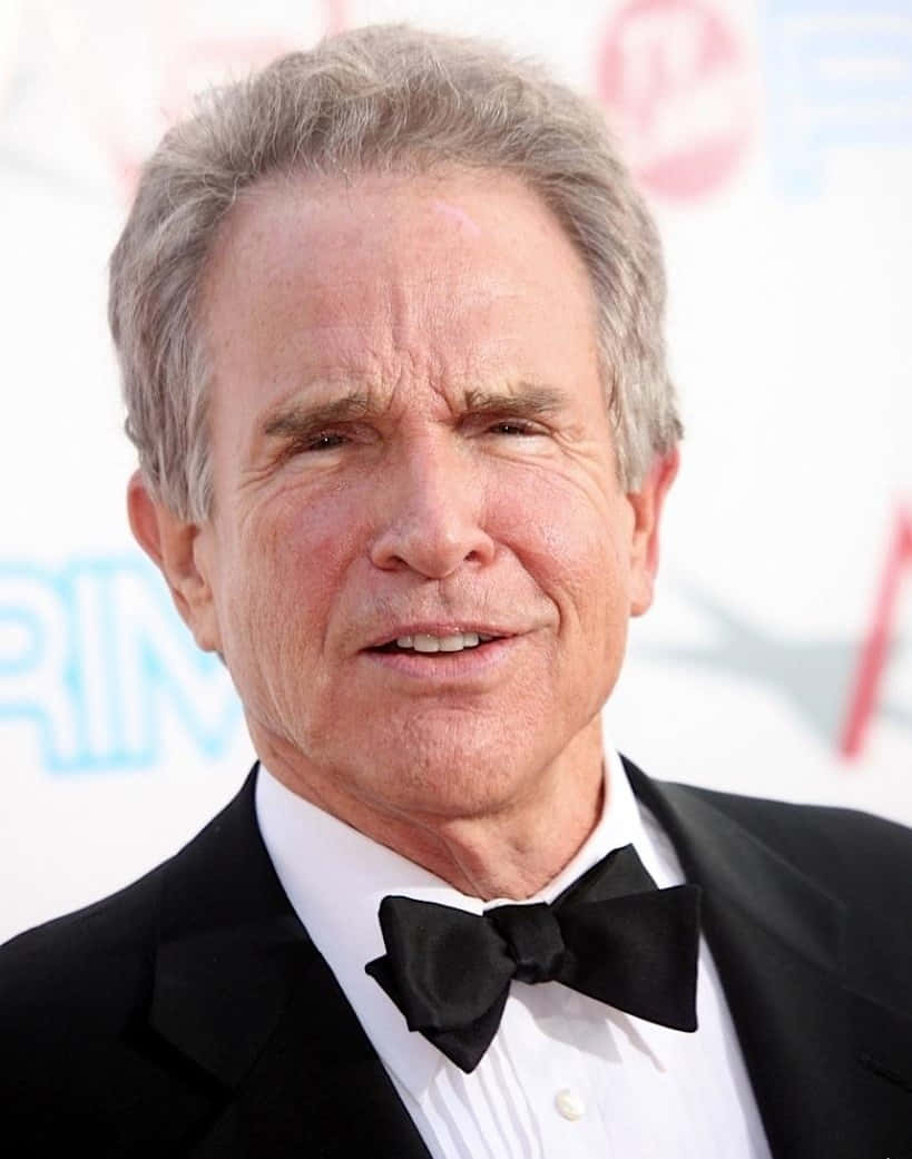 Hollywood Legend Warren Beatty Smiling In Classic Portrait Background