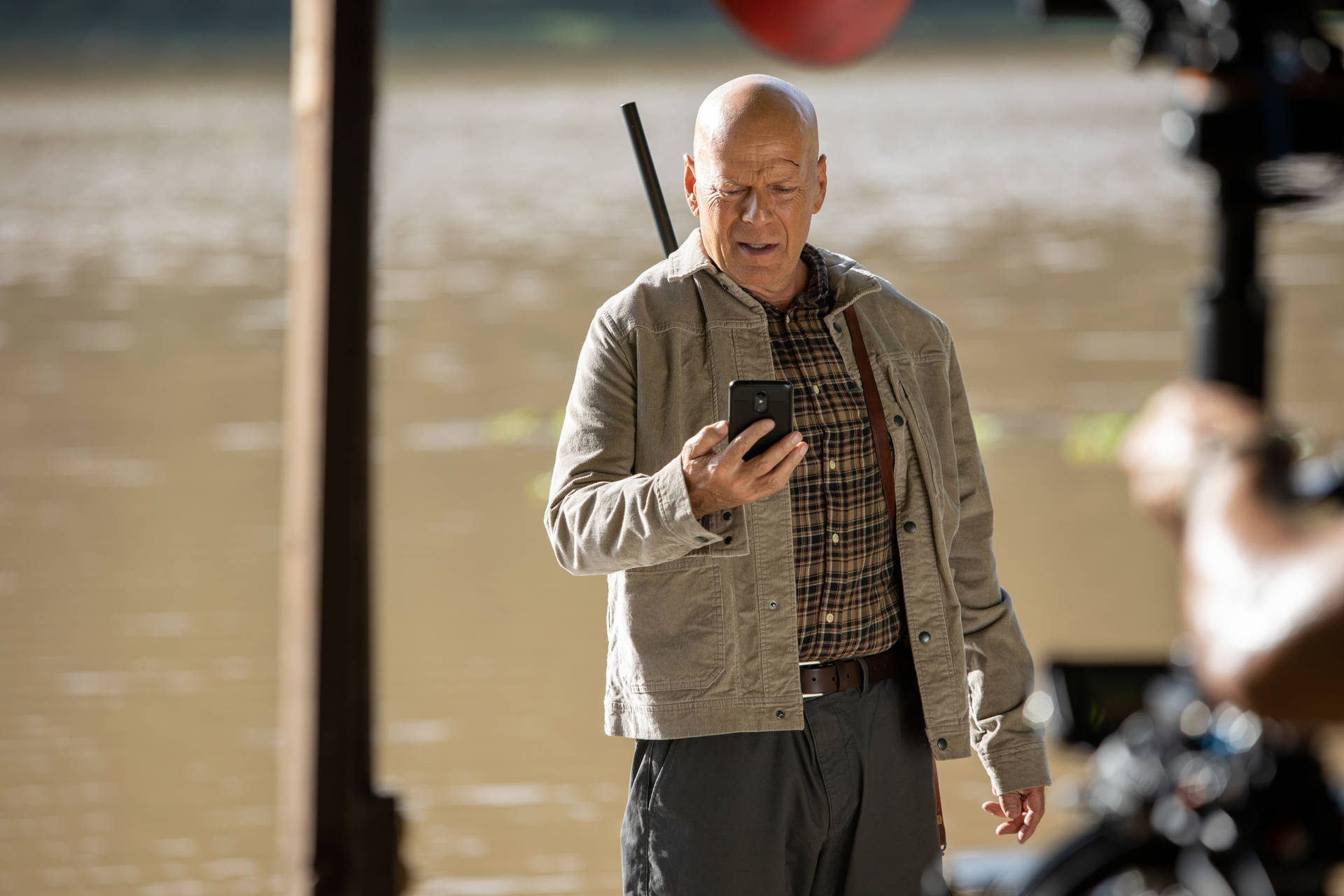 Hollywood Star Bruce Willis Rocks An Action Movie Look Background