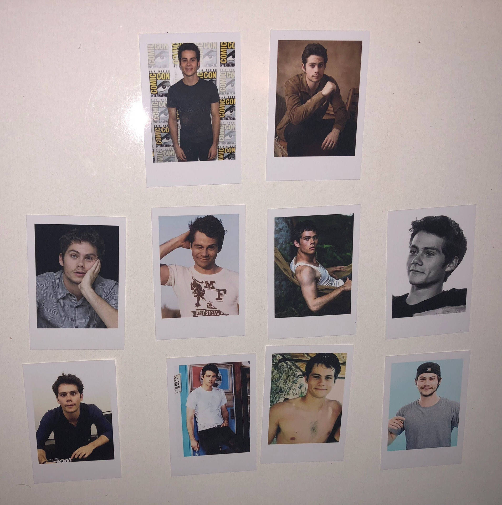 Hollywood Star Dylan O'brien Posing With Polaroid Pictures Background