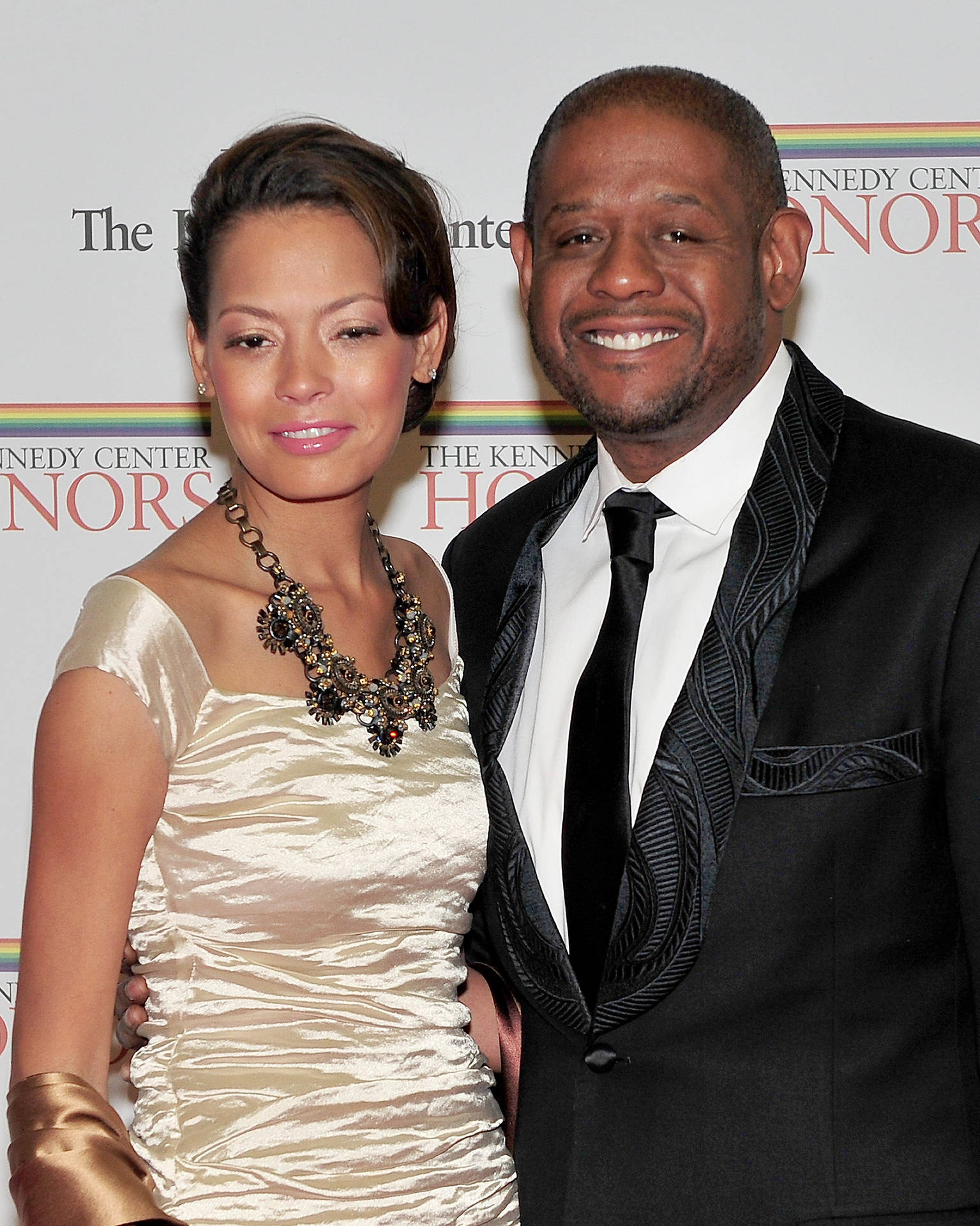 Hollywood Star Forest Whitaker Alongside Wife Keisha Nash At A Public Event. Background