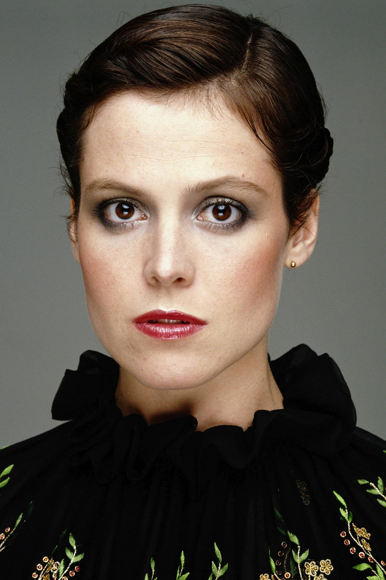 Hollywood Veteran, Sigourney Weaver, Flaunting Her Smokey Eye Makeup. Background