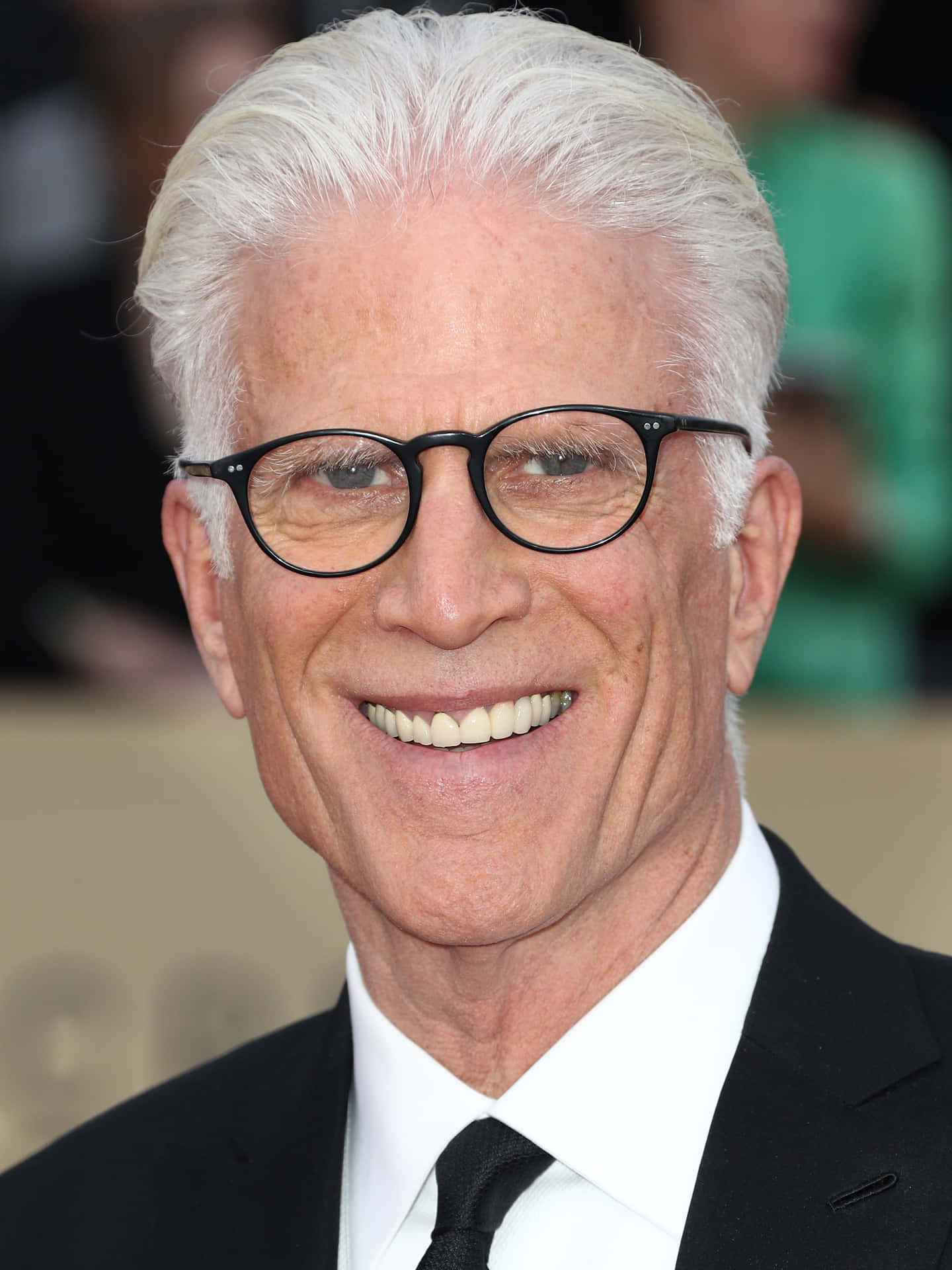 Hollywood Veteran Ted Danson Radiating Charisma In A Close-up Shot Background