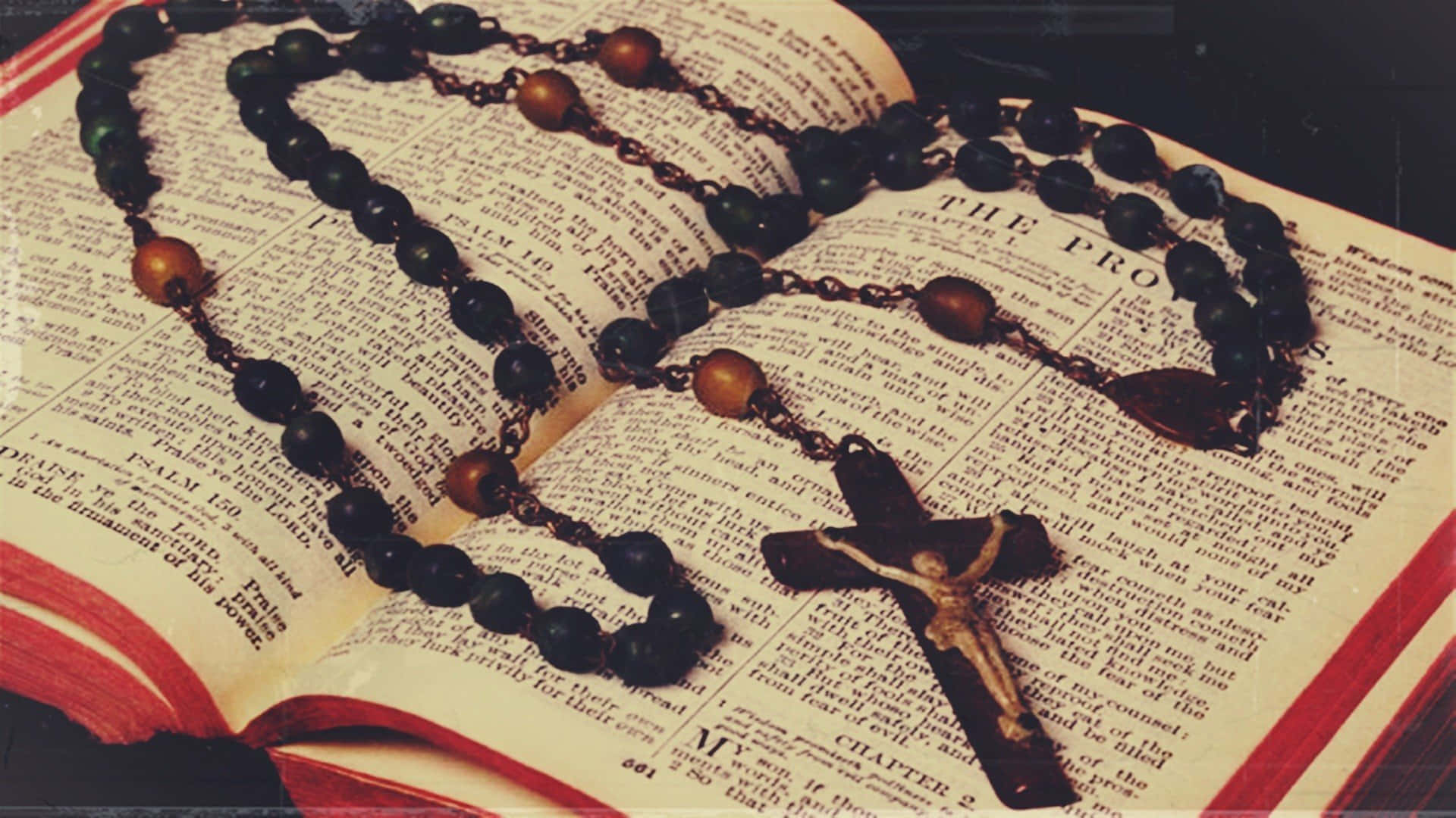 Holy Bible With Black Rosary Background