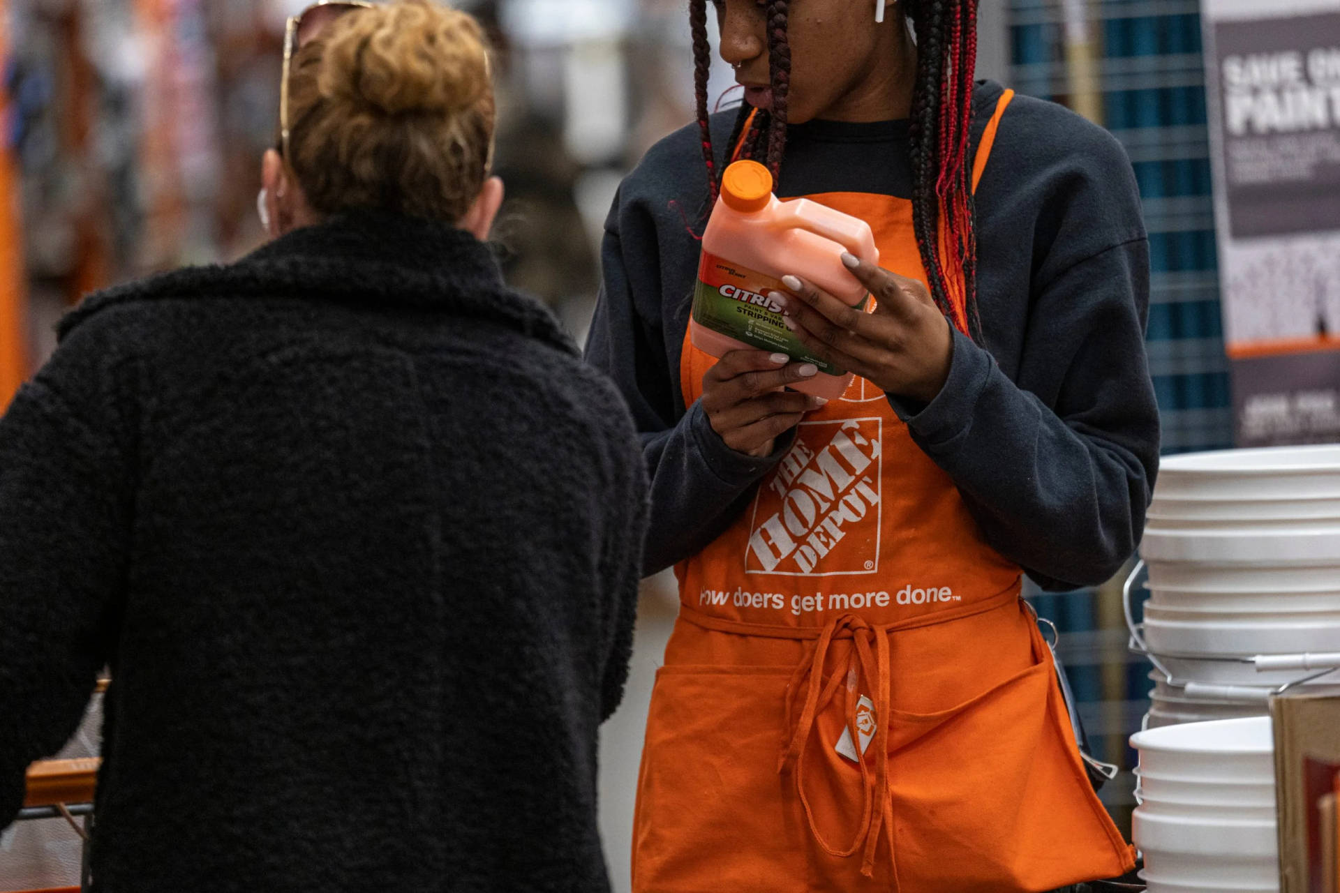 Home Depot Employee Assisting Customer In Store