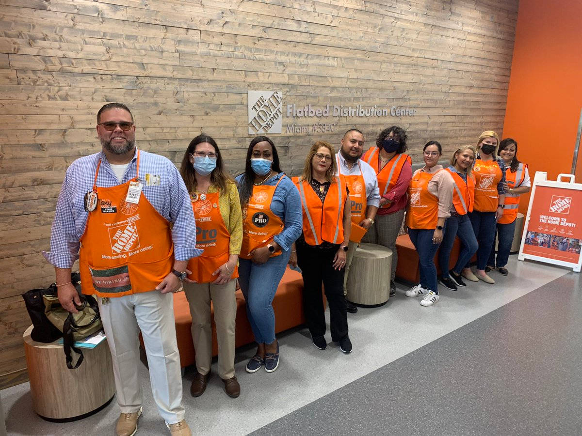 Home Depot Employees In Orange Background