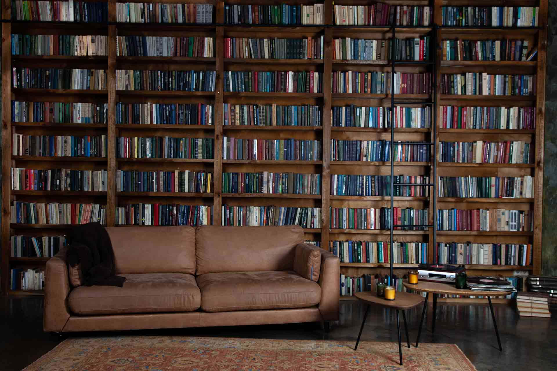 Home Library Brown Couch Coffee Table Background