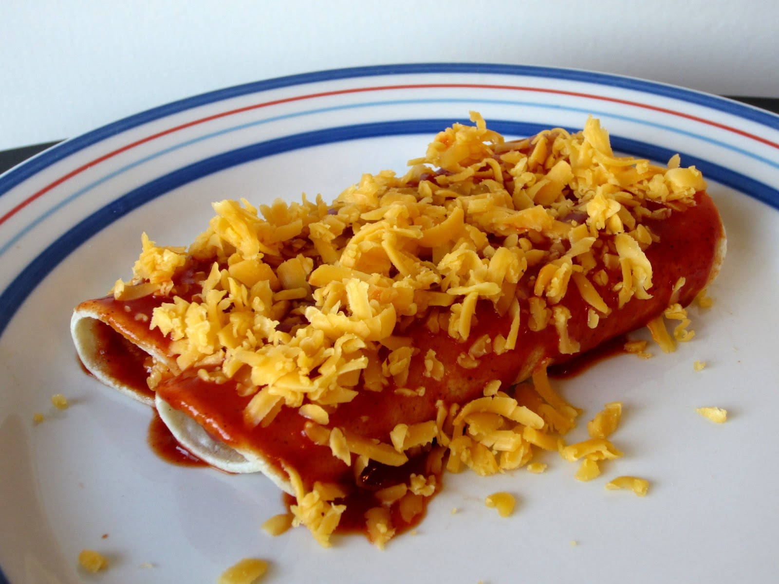 Homemade Enchiladas With Cheddar Cheese Background