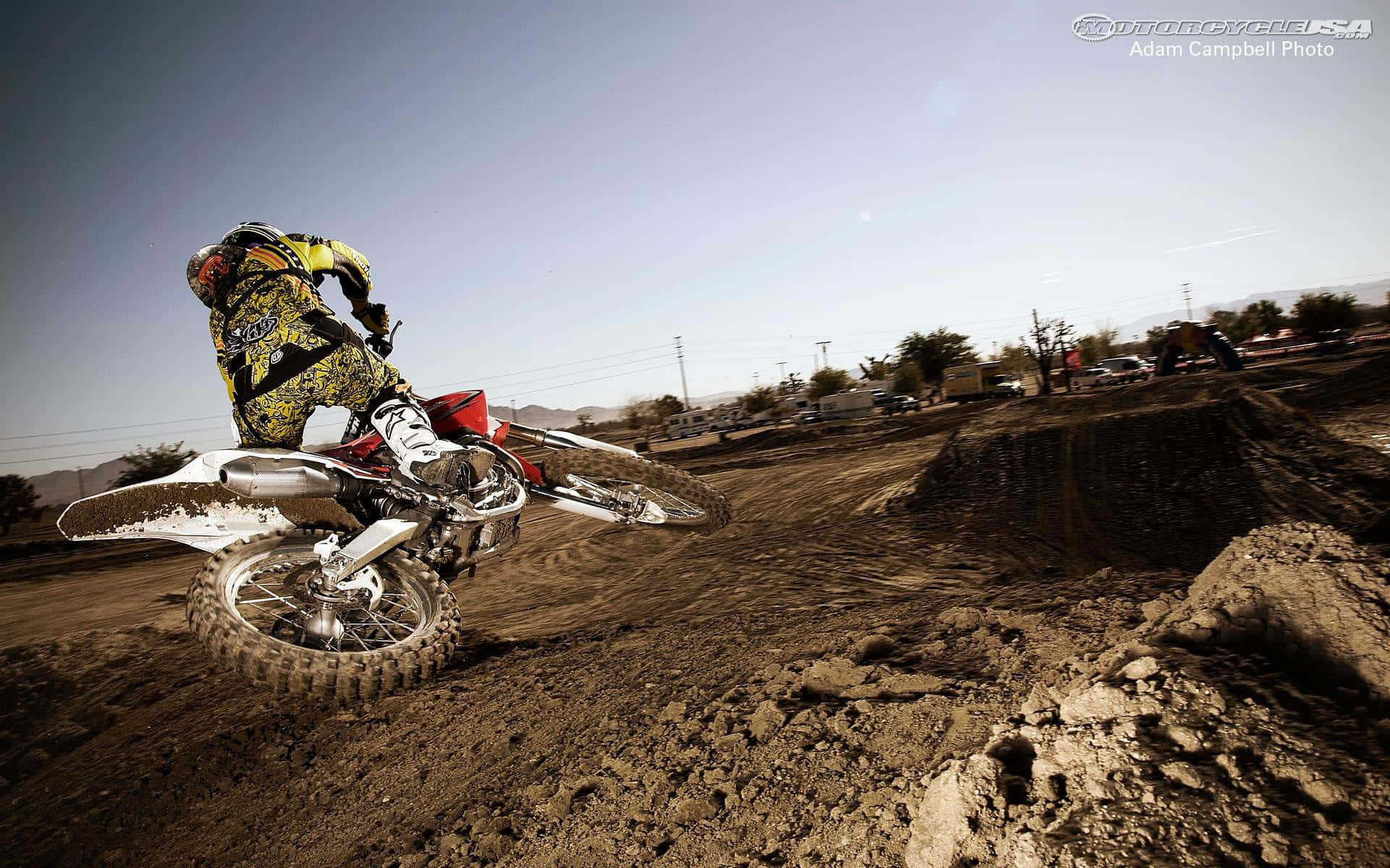 Honda Dirt Bike About To Fall Background