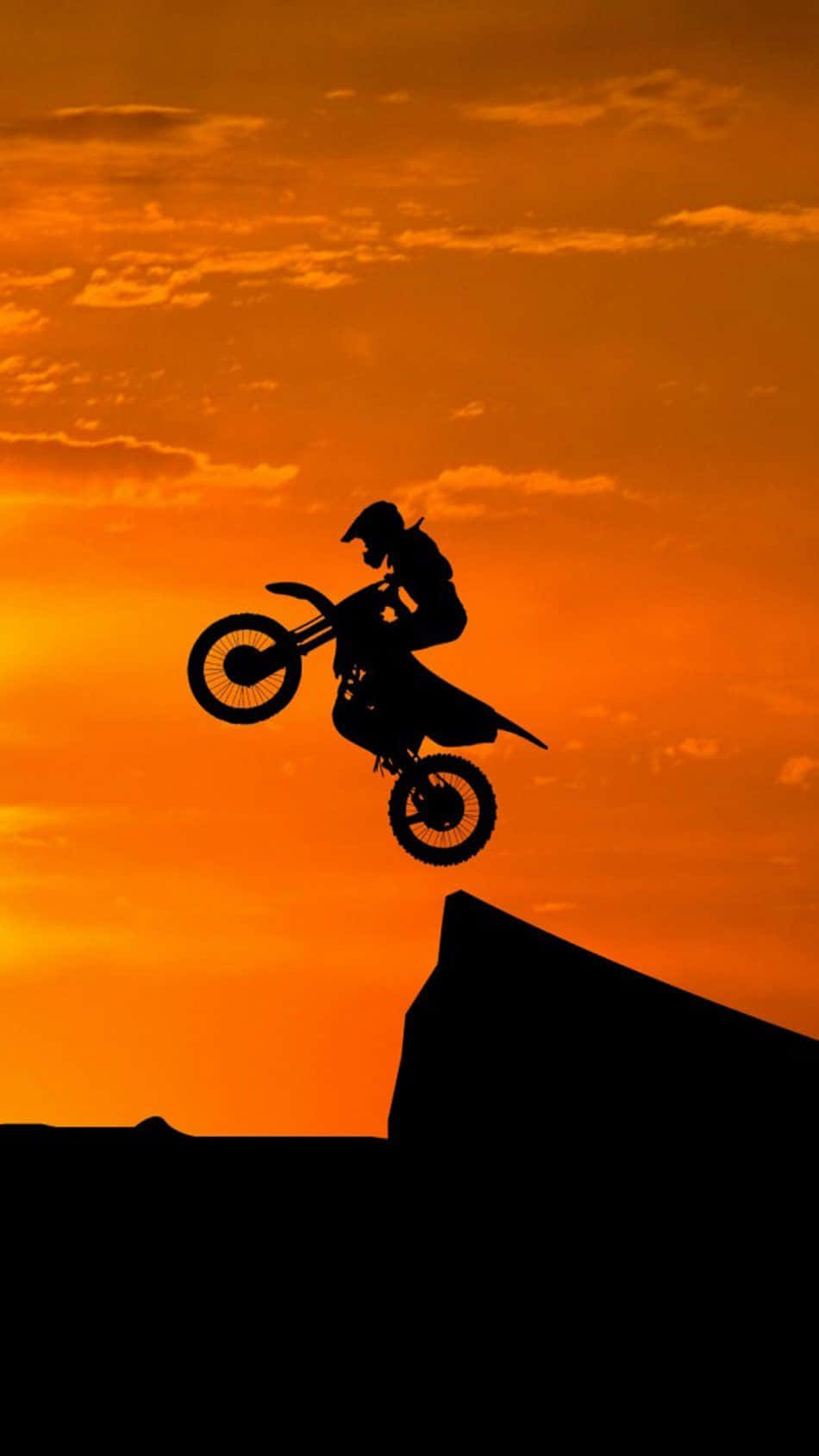 Honda Dirt Bike Jumping Off Cliff Background