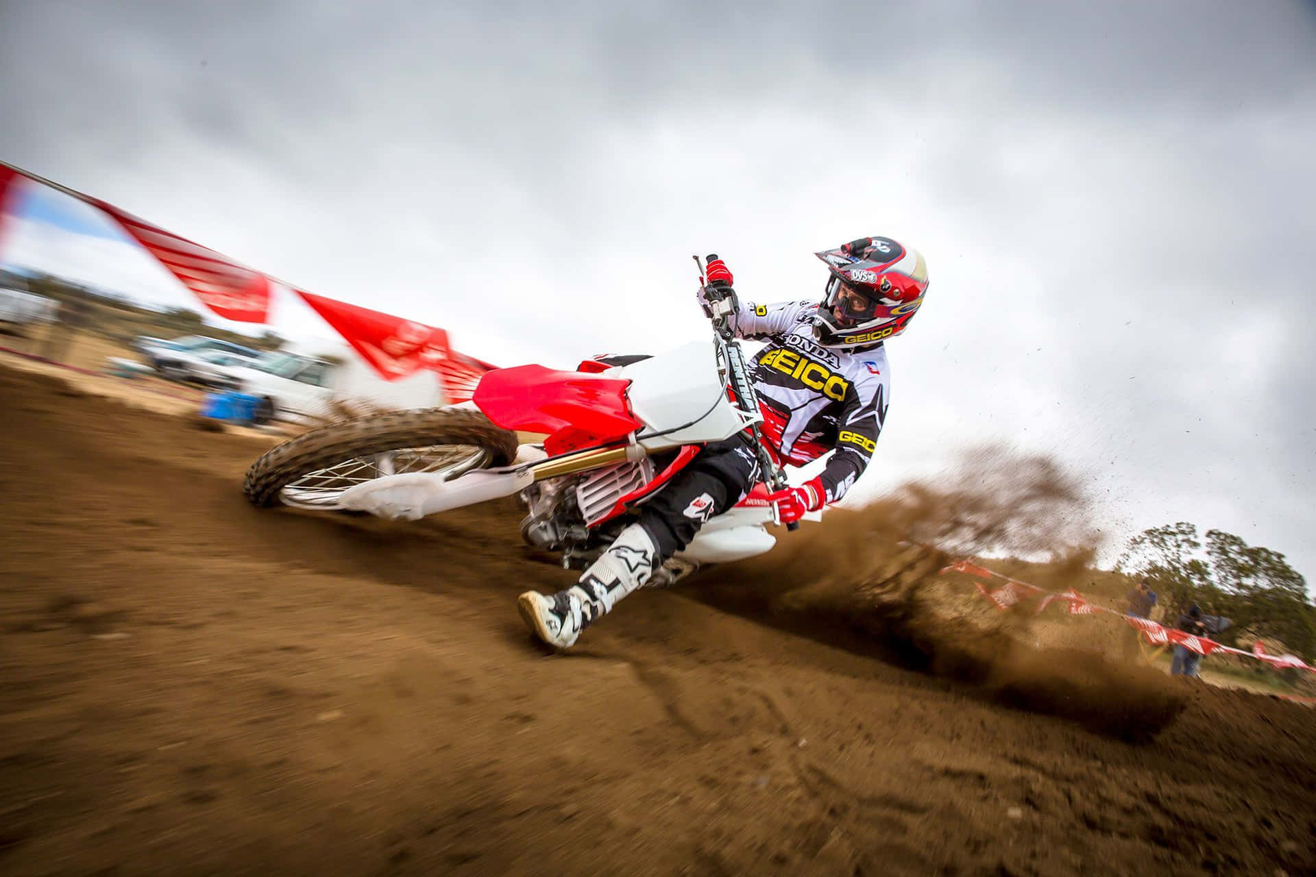 Honda Dirt Bike Red Swerving Left Background